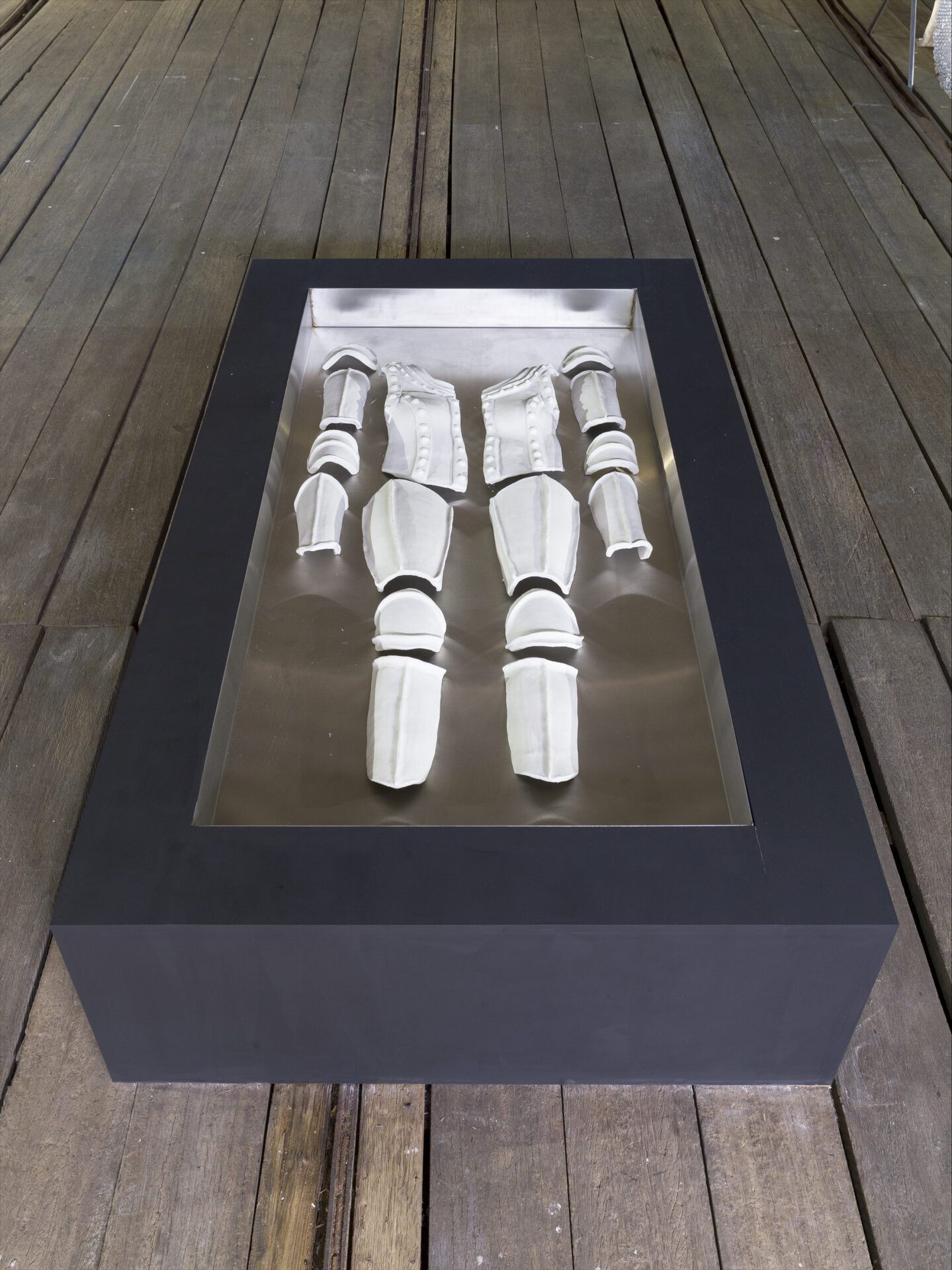 Keegan Luttrell, Membrane, 2021, dims variable, unfired clay, stainless steel, MDF, water.