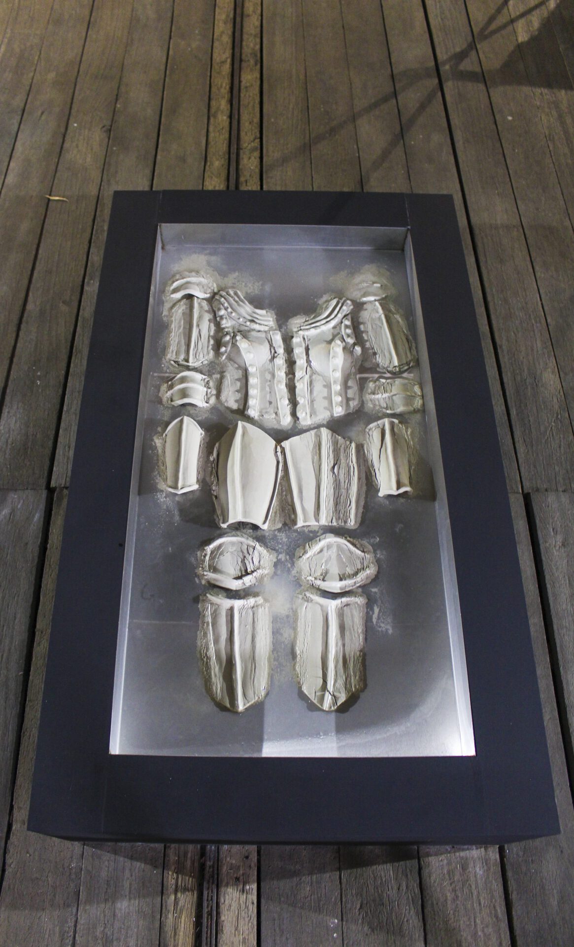 Keegan Luttrell, Membrane, 2021, dims variable, unfired clay, stainless steel, MDF, water.