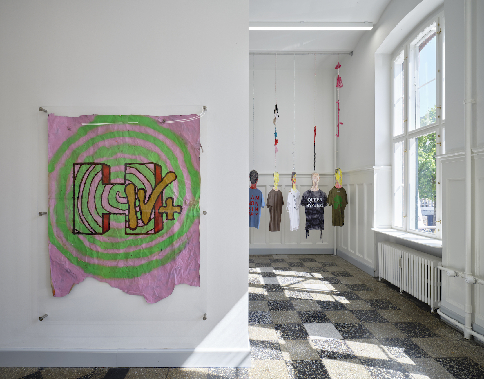 left: Nicolas Maxim Endlicher: MTV+, 2020. Acrylic and graffiti on paper Right: Filip Berg, ©T-estimony, Han Kjøbenhavn, O—Overgaden: HEN, 2021. T-shirts, print.