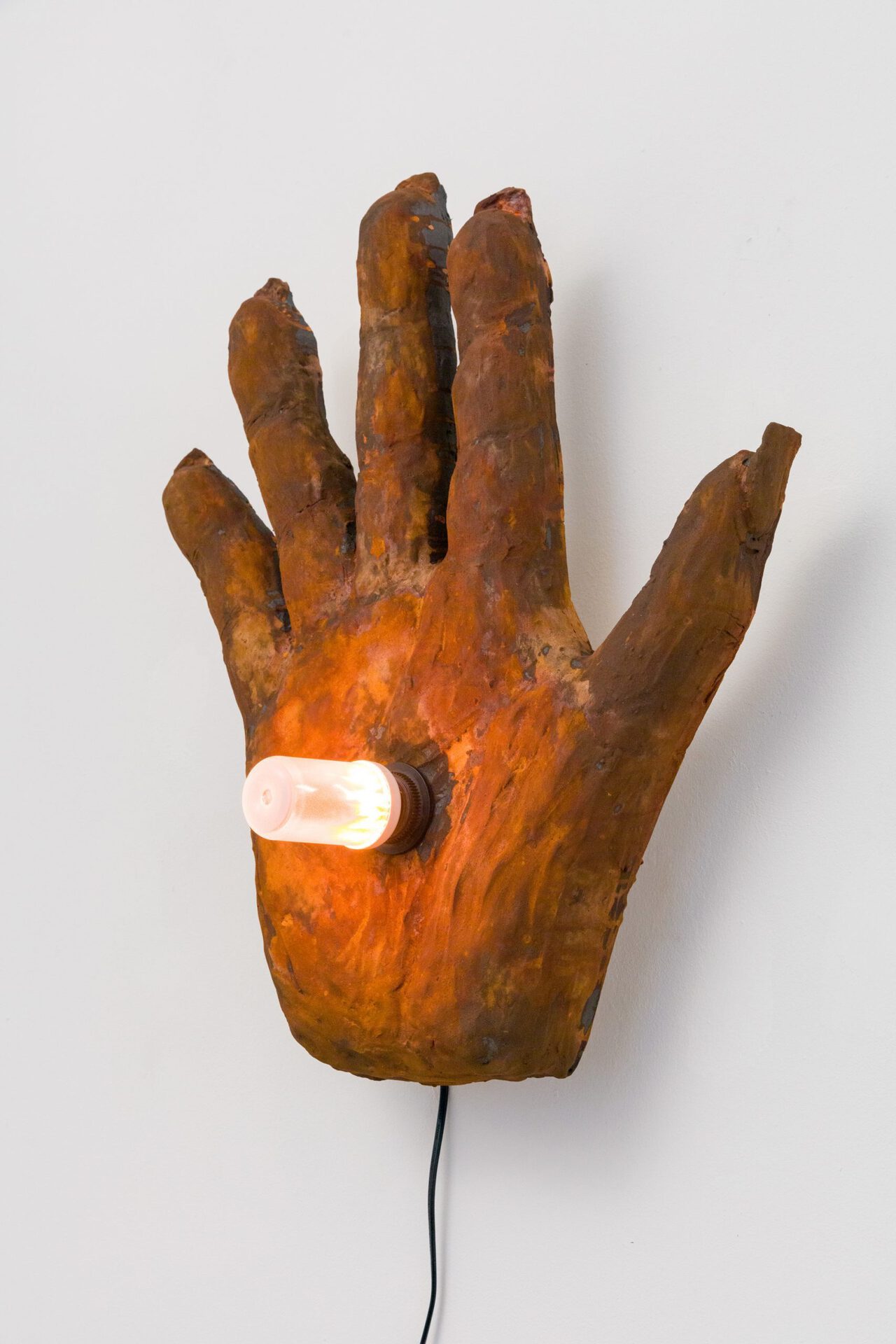 Gabriele Edlbauer & Julia Goodman, Single #3, 2019, acyrlic resin, rust paint, cable, light bulb