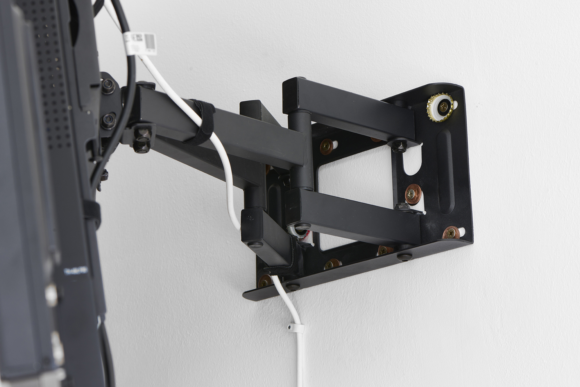 Shane, 2021, two 48 inch flatscreens with customised wall mounts, coins, bottle caps, 11 min 44 sec, looped, speakers, dimensions variable (detail)