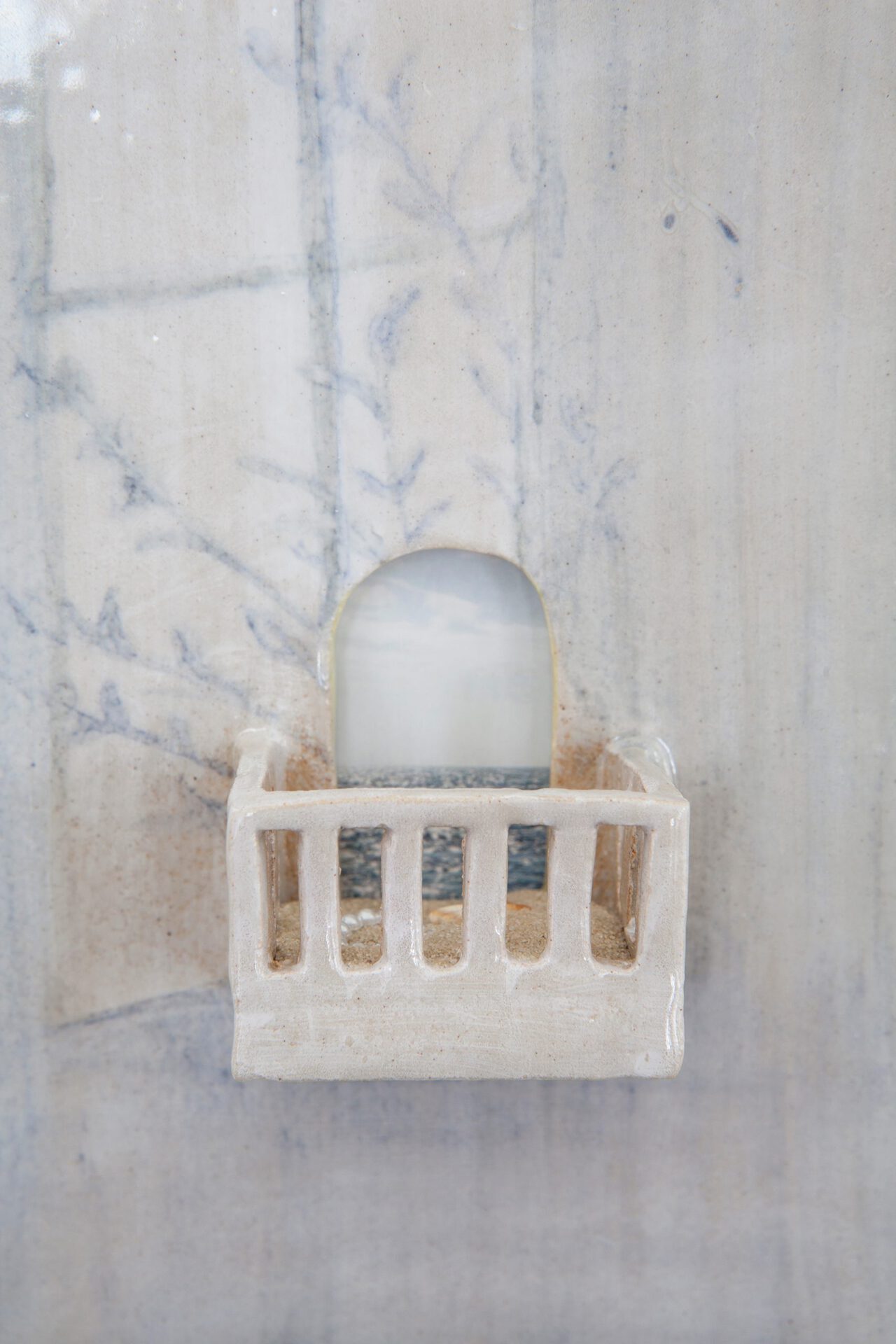 (detail) balcony tile #1, 2021, underglaze-paint on stoneware, sand, plastic-pearl-heart, seashell and Collage, 21,2 x 13,5 cm