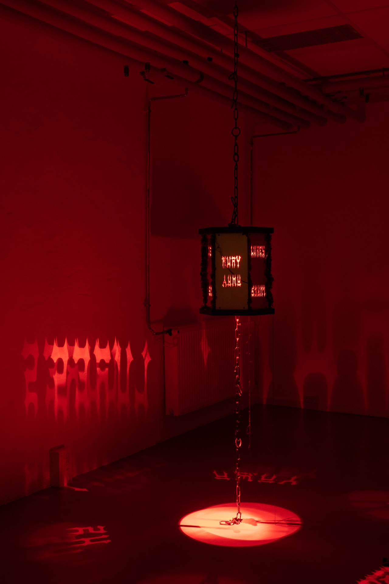 Kerosene (Lures us away), steel, wood, light, silk, aluminium, 2021 (In the dark)
