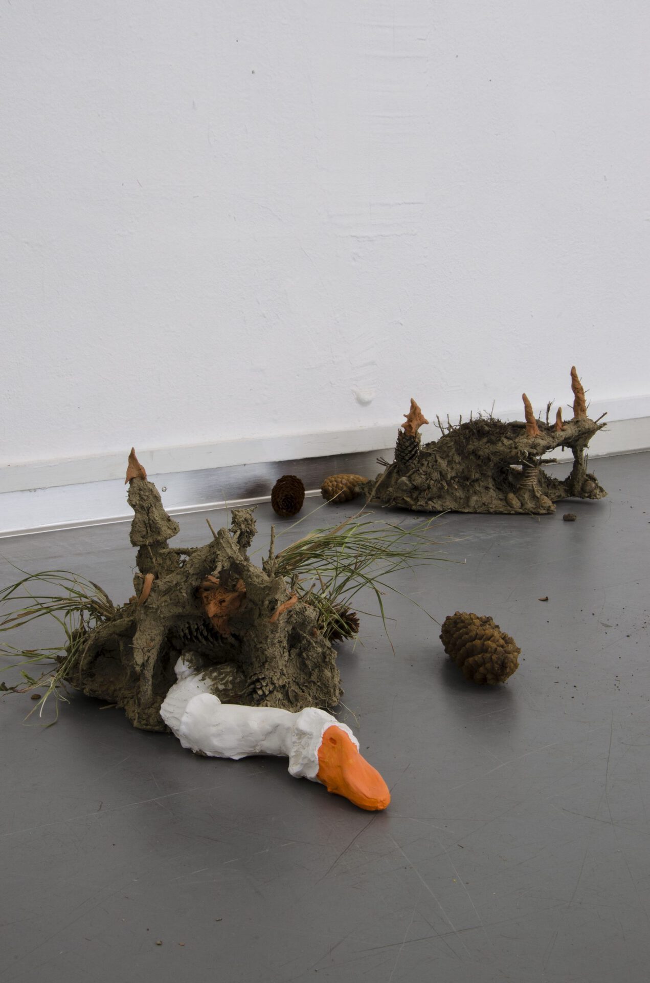 burrows, 2021, polyurethane, paint, dirt, sticks, stones, cones