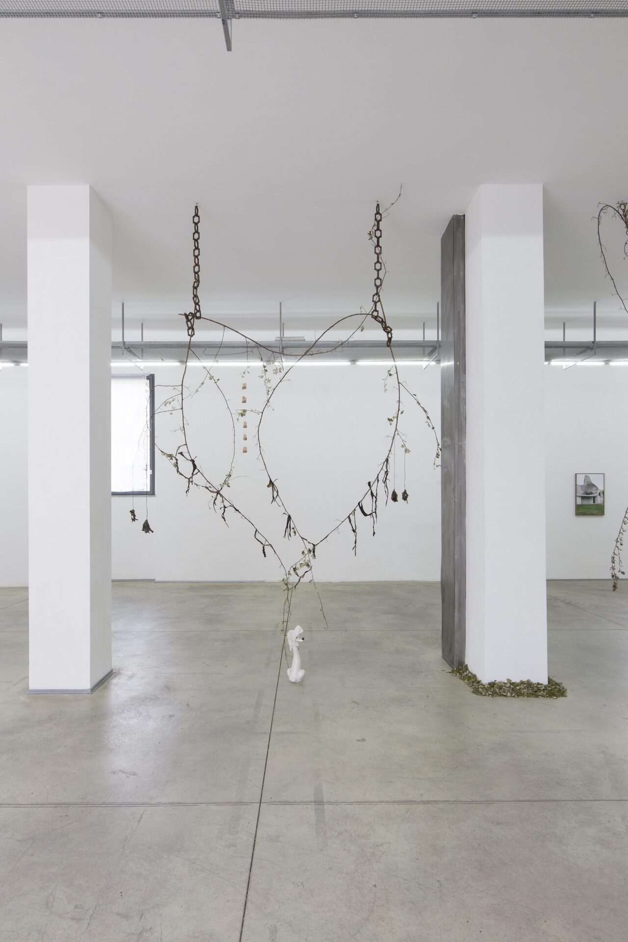 11. Pietro Agostoni, The Crucifixion of Banana-Bats, chains, ceramic, thistles, brambles, bones, hair, wax, palo santo, firecracker, dragonfly, water lily leaves and flowers, trash, variable dimensions, 2021 Photo by Gabriele Abbruzzese.