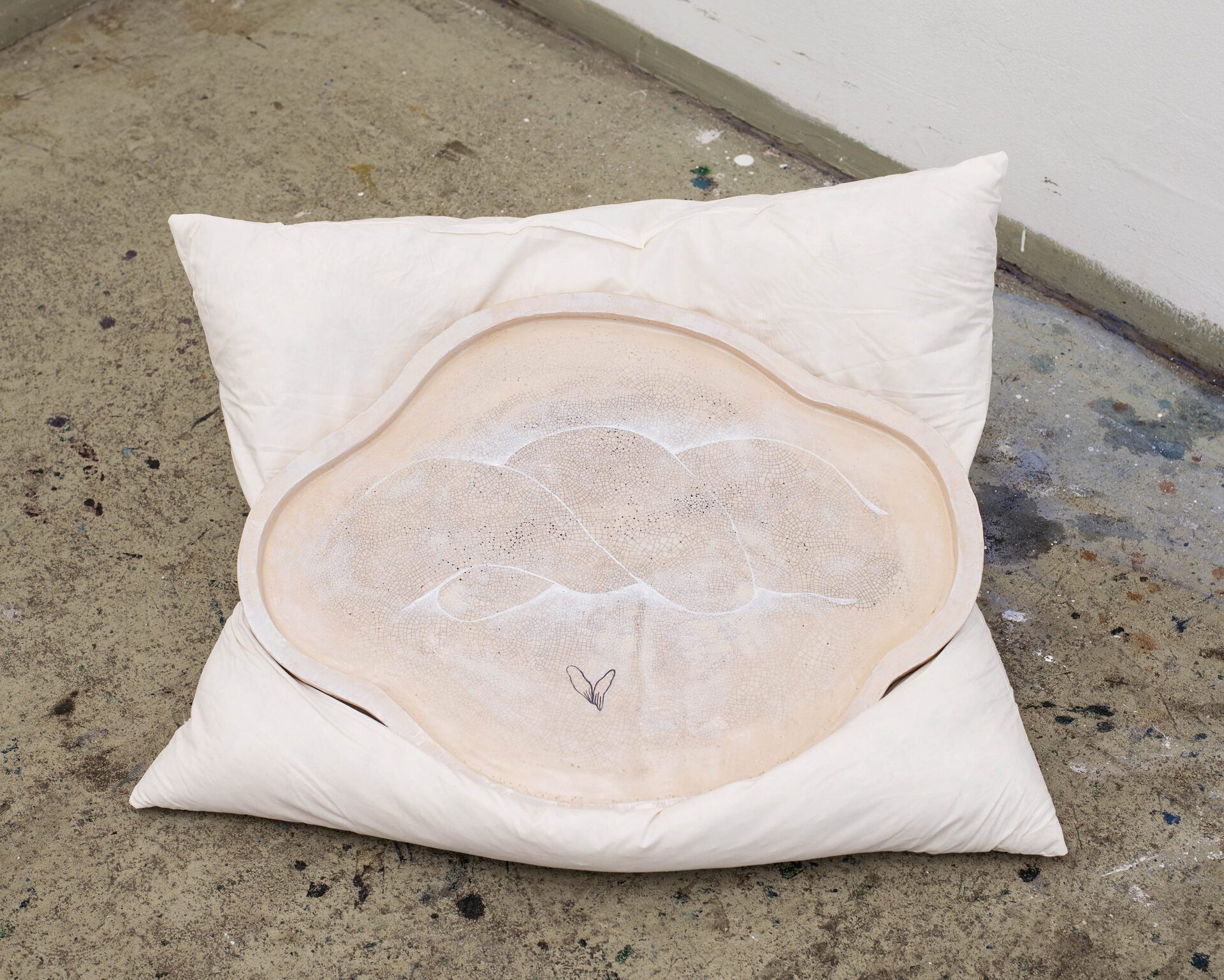 Pho 2, 2021, oil on ceramics, ~ 30 x 40 cm, installed on feather pillow
