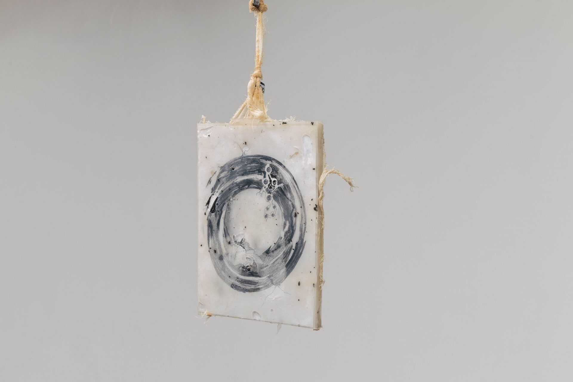 Hanged 2. 2021, hypoallergenic silicone, drawing, cheesecloth, rust, screw-nuts, ground, oil traces looped sound 06’54” 22.5х18х1 сm
