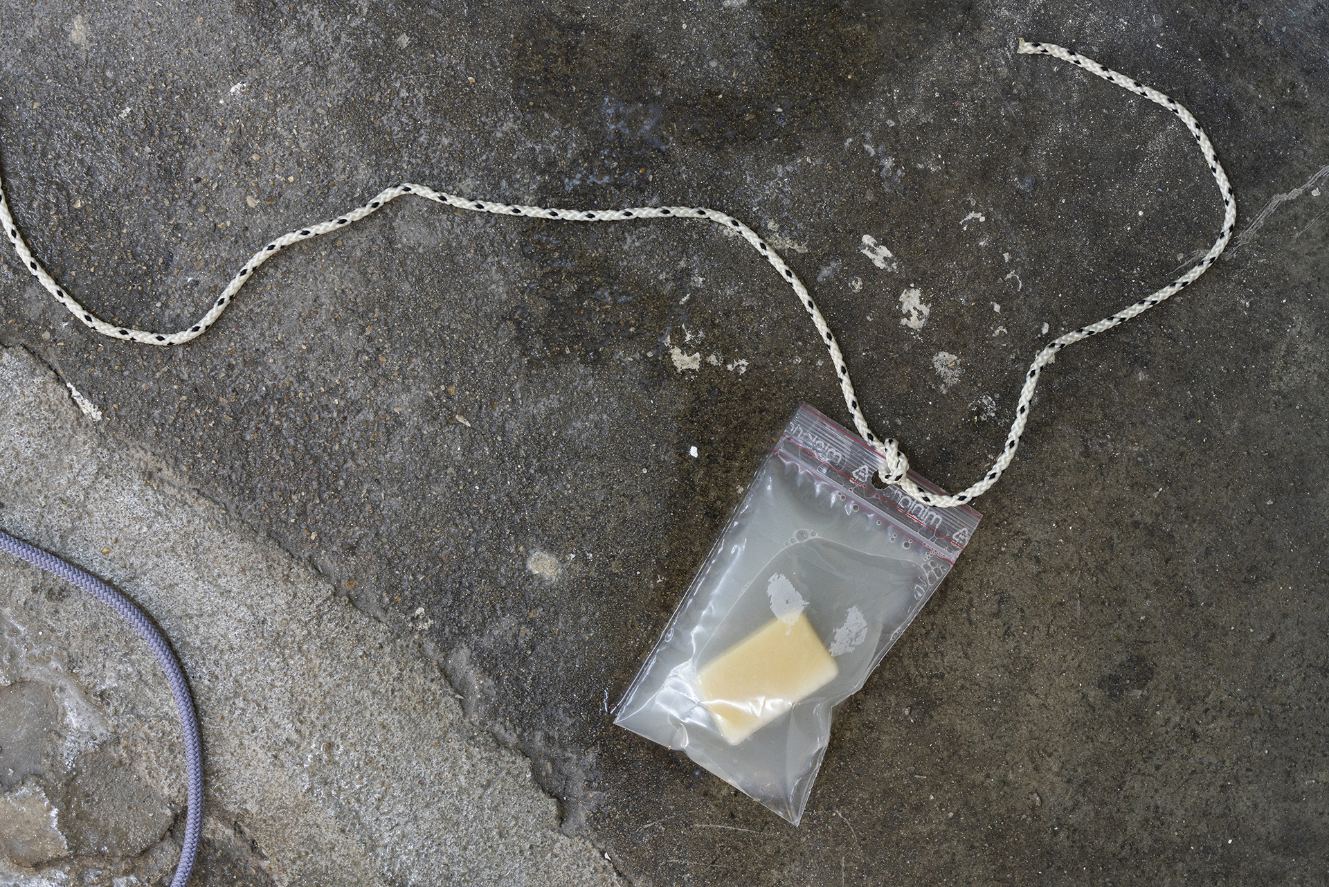 Edouard Nardon, Alpha Scorpii (detail)
, 2021, Painted terracotta, copper tube, ropes, peep hole, soap, water, ziplock, printed paper, metal container, linen oil, acetone, memory foam, metal tool, Variable dimensions