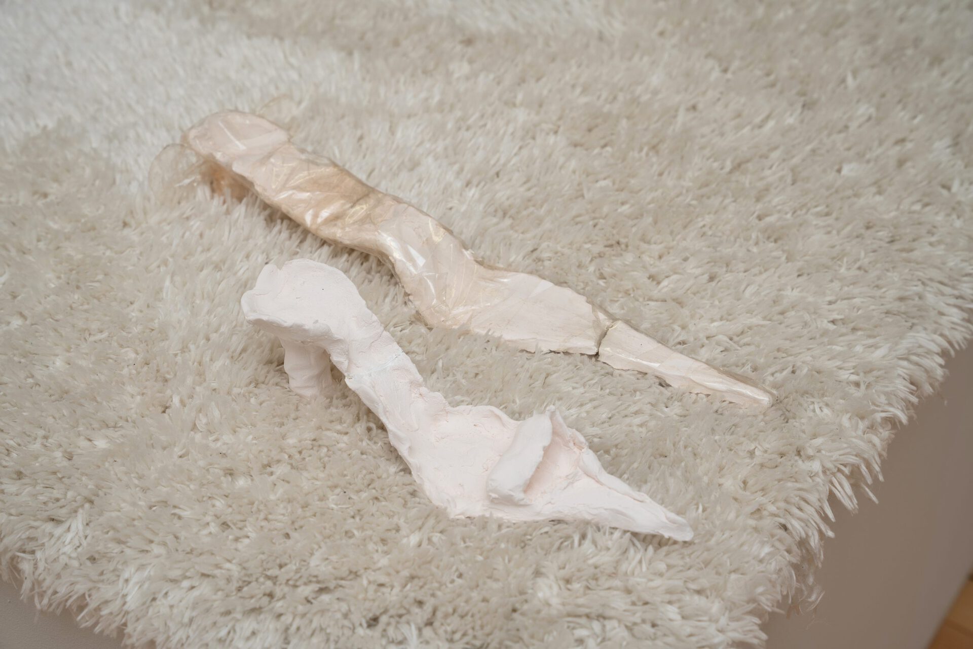 Carla Milentis, Silky, 2021, Porcelain and tile glue, 28 x 7 x 8cm and Got to Give it Up, 2021, Porcelain and packing tape, 43 x 5 x 4cm