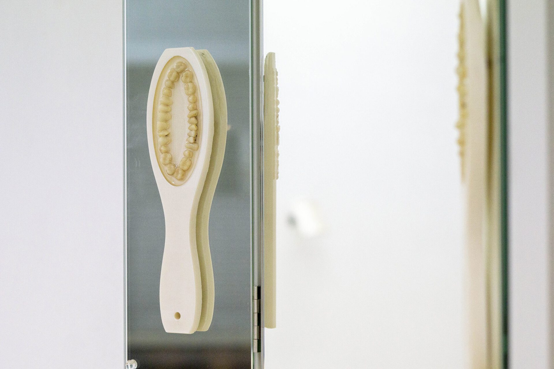 Kay Yoon, Mirrored, 2021, Mirror, PLA, Plastic Teeth, 50 x 60 cm