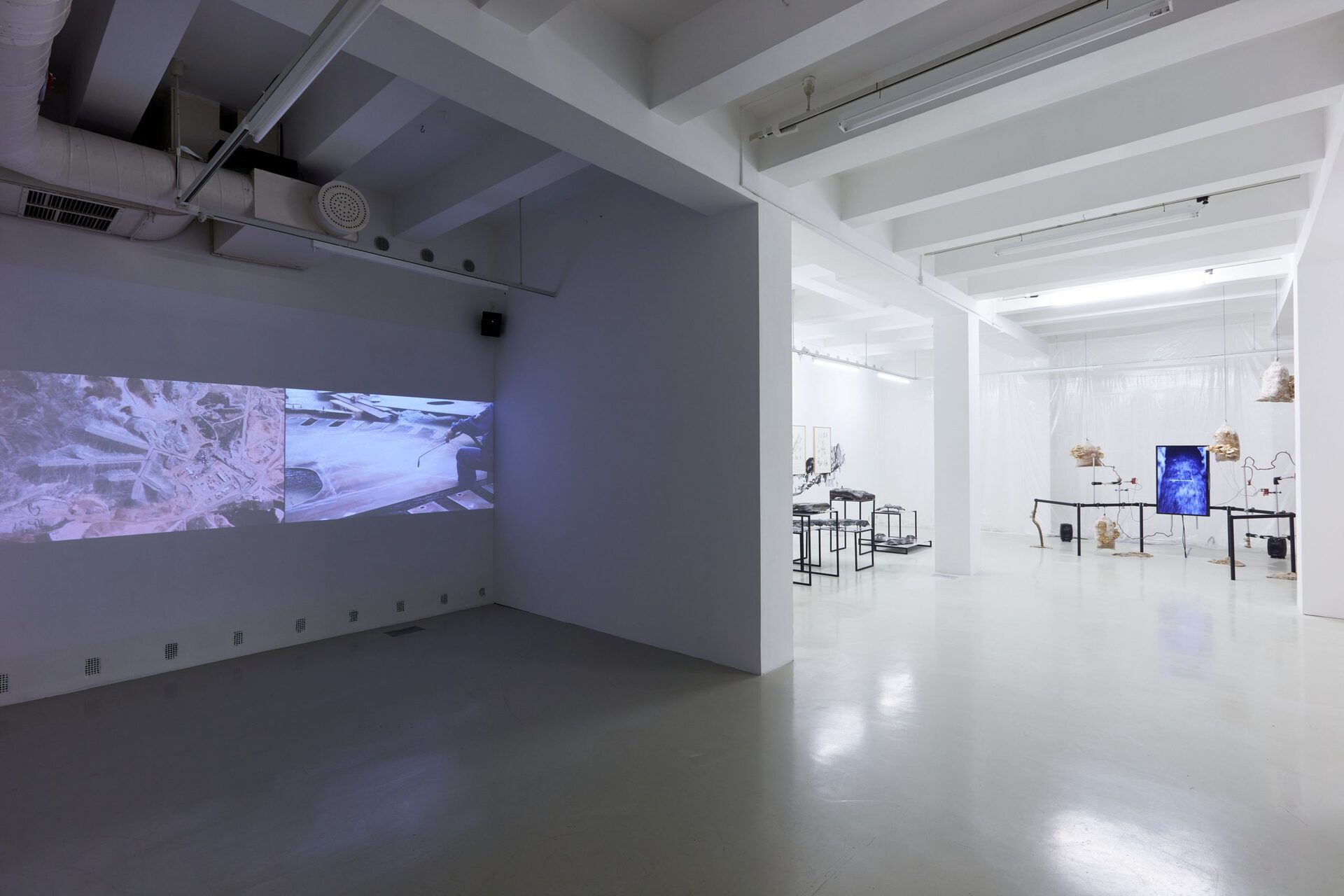 Anca Benera & Arnold Estefán: Subnature | exhibition view | left: Blue Ground, 2021, right: Debrisphere. Landscape as an extension of the military imagination, 2017 – 2021 | photo: Dávid Biró