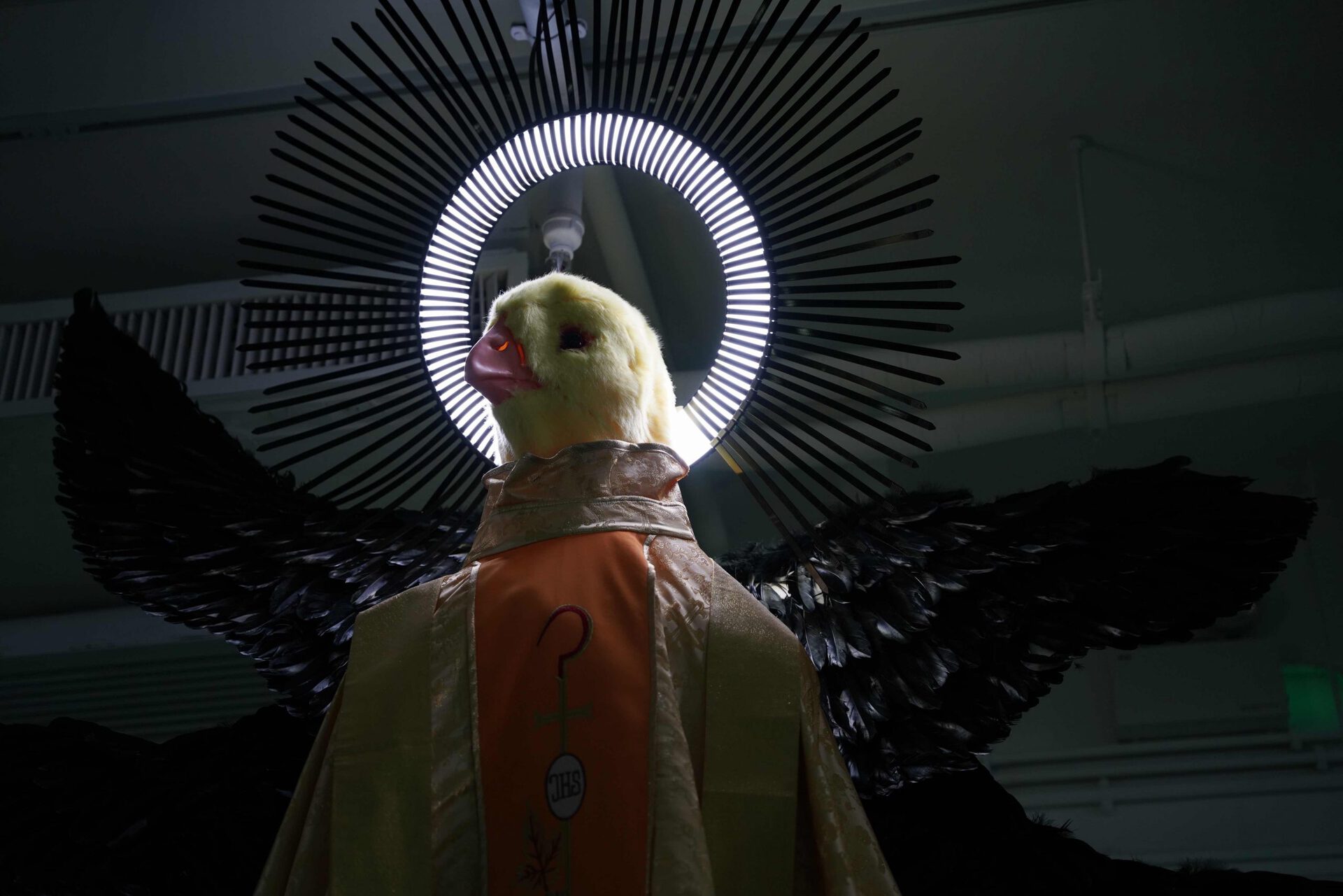 Chen Pin Tao, Seraph 002, 2021, Digital print on faux silk, embroidery on faux silk, feathers, LED light, animal head mask, 350 x 310 x 200 cm