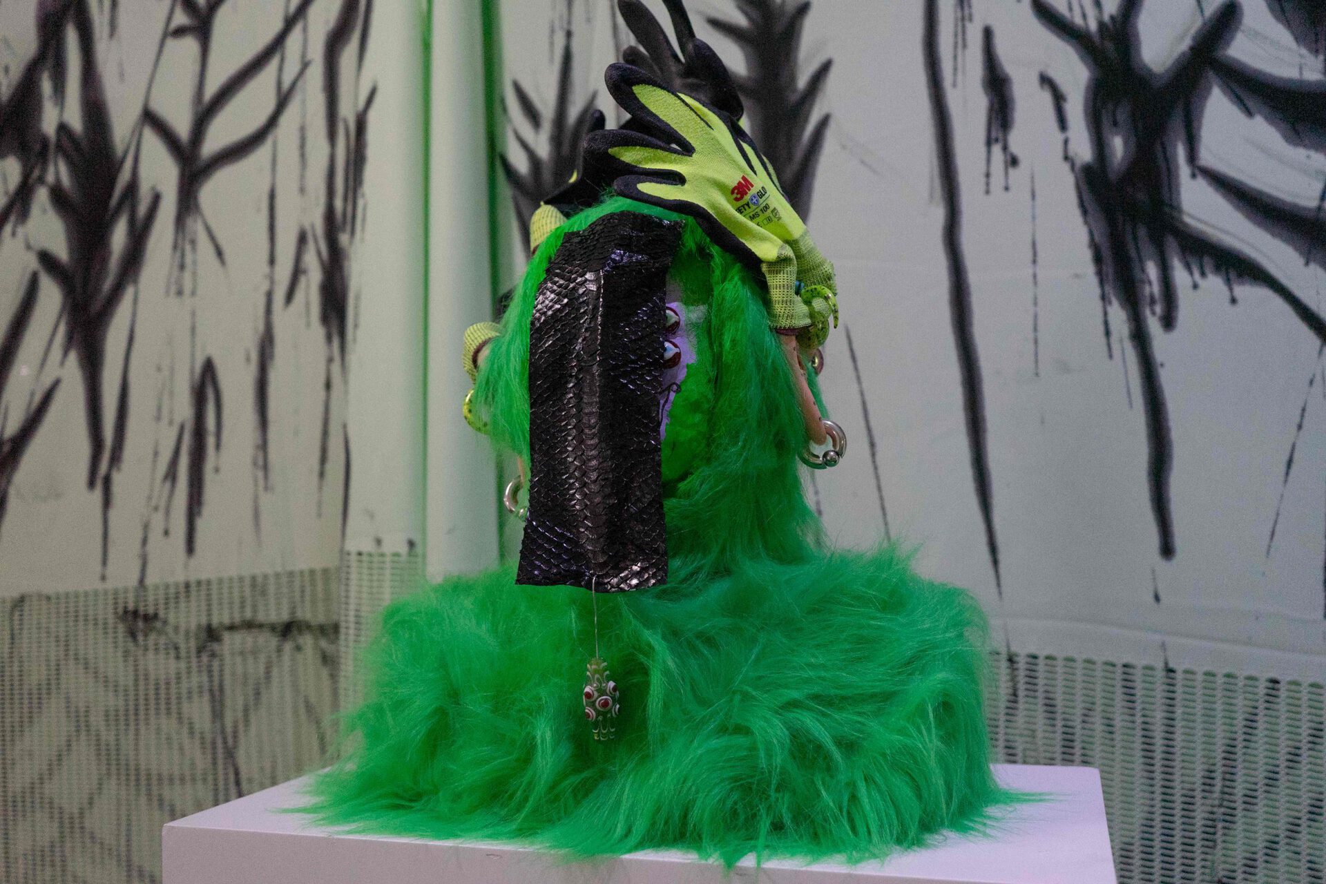 Chen Pin Tao, Bust of a Tribesman (Sealed), 2020, Faux fur, paper clay, 3M gloves, body piercing jewellery, PVC acupuncture ear model, snake skin, glass beads, 65 x 45 x 25 cm
