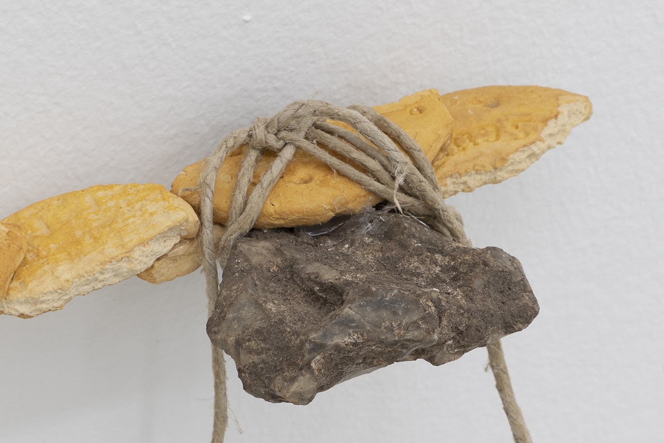 Kåre Frang, Attachments, 2021, Hand-painted Jesmonite, silicone, hot-melt glue, epoxy, varnish, stone, twine, 34 x 8 x 3 cm