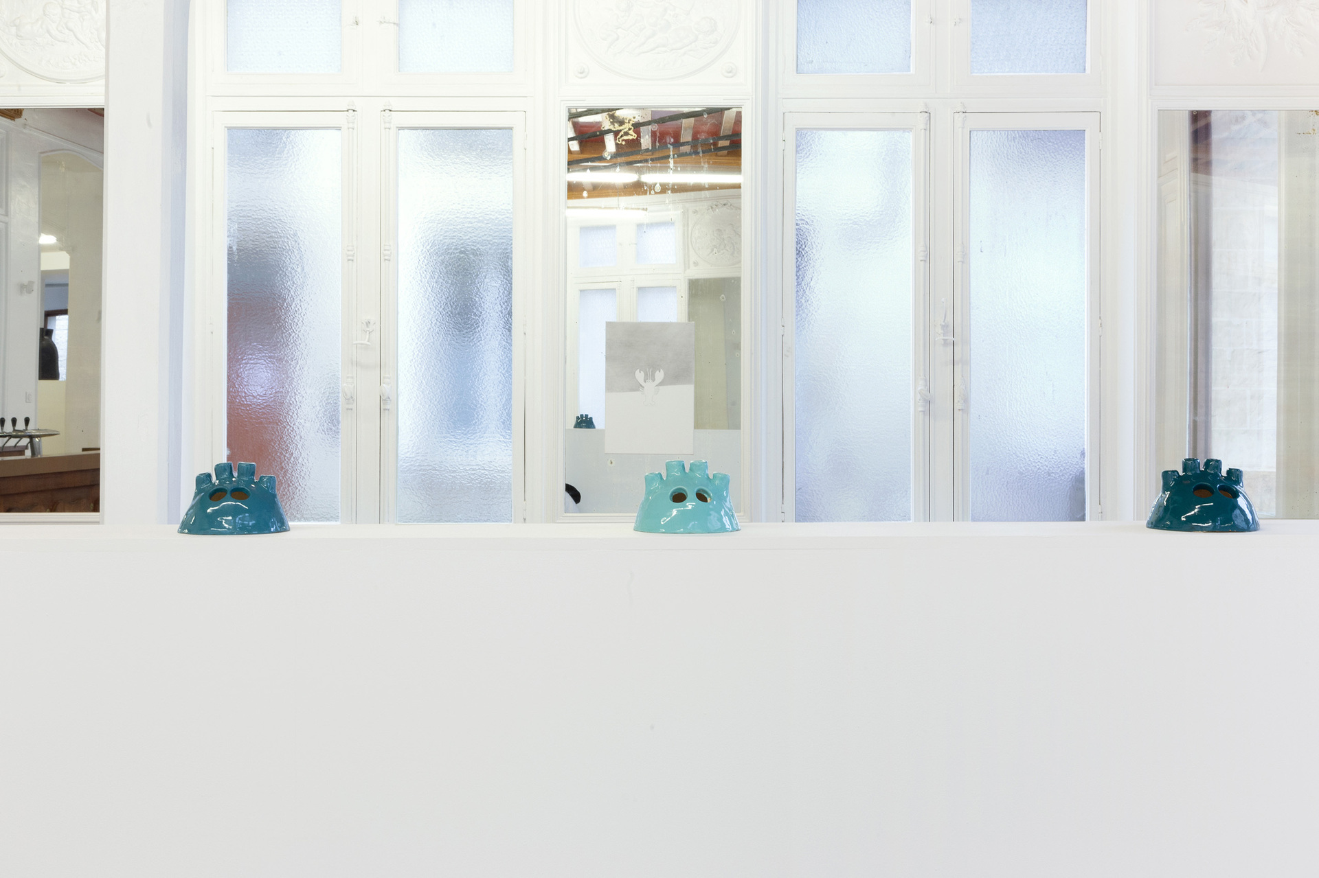 Foreground: Hélène Labadie, The Baby bad seeds, (candlesticks for giant table), 2021 Background: Melanie Akeret, Lobster 0, 2021