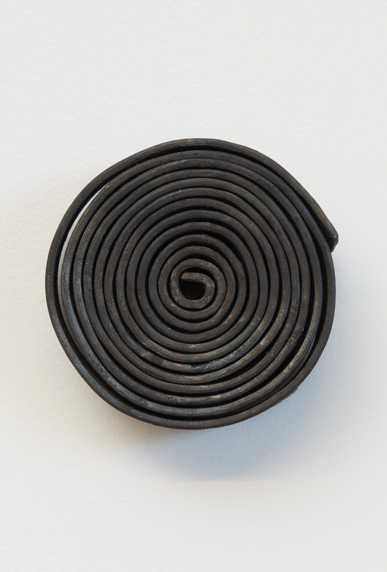Julia Znoj, Deadly Swirls (wrapped up scripts), 2020 smithed metal strip 38 x 5 x 2.5 cm