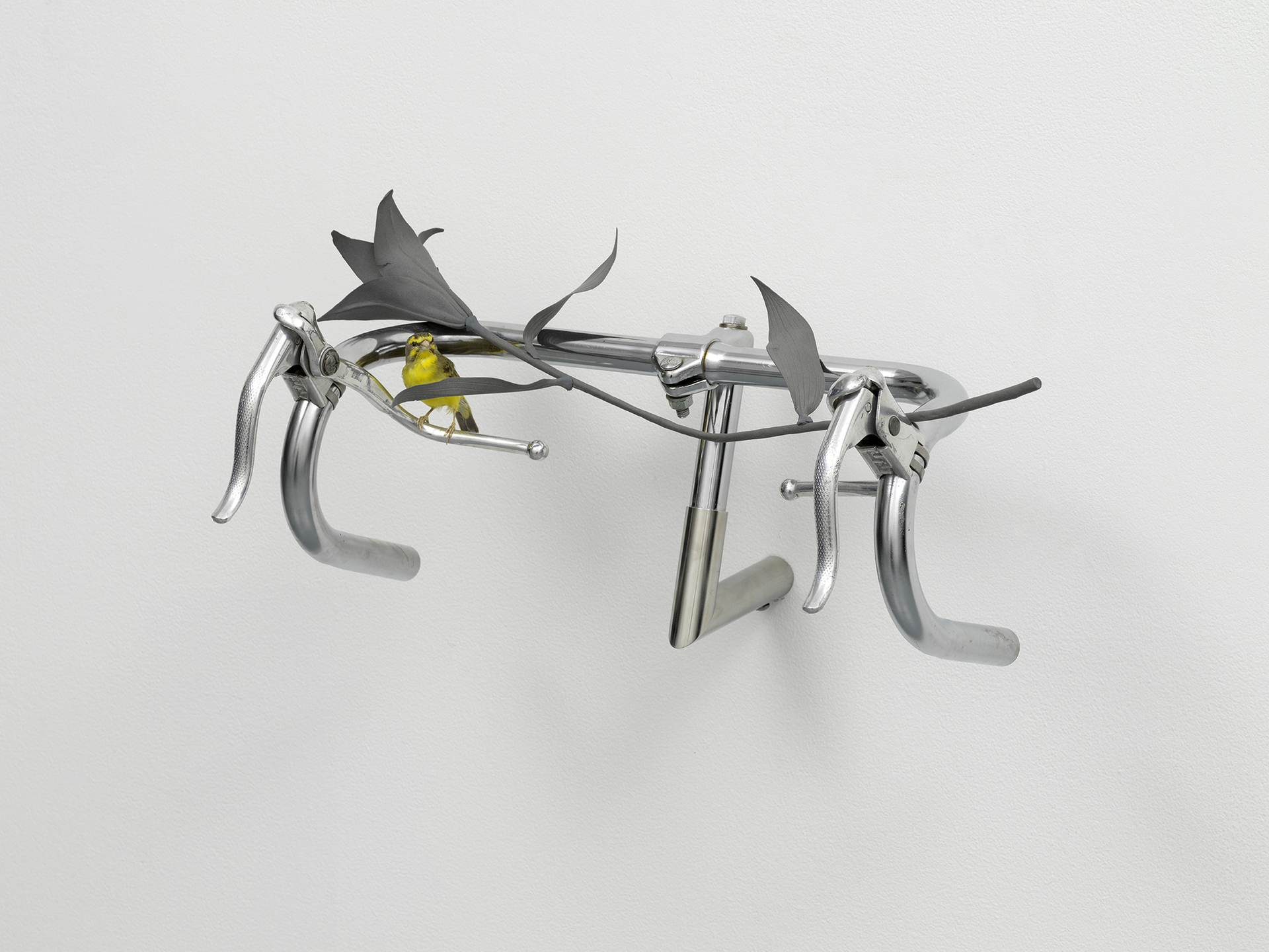 Christine Rebhuhn, Ride or Die, 2021, Chrome bicycle handles, colored porcelain, taxidermy canary, 8 x 20 x 13 inches.