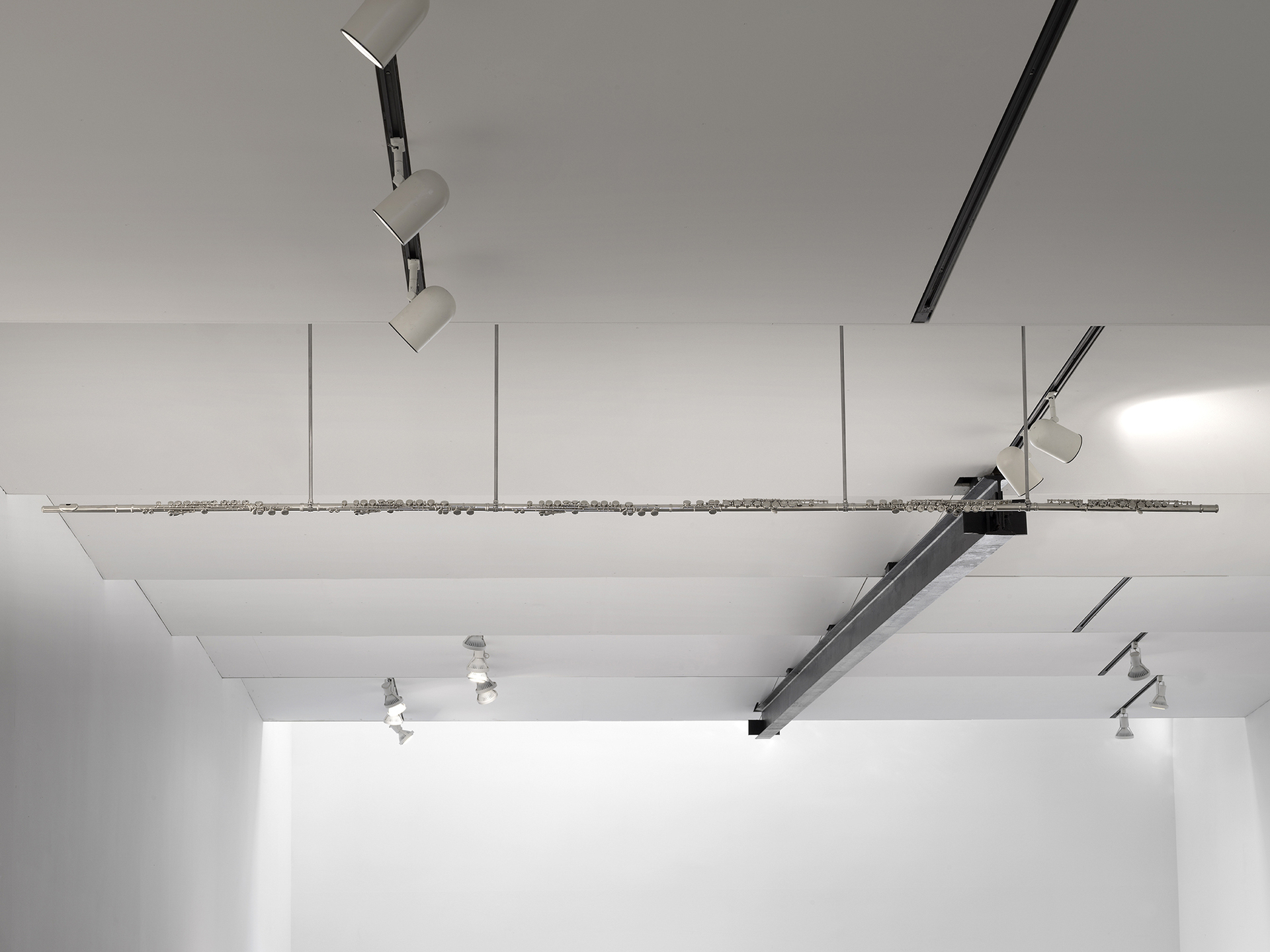 Christine Rebhuhn, Long Wind, 2021, Flutes, hardware, 25 x 120 x 1 inches