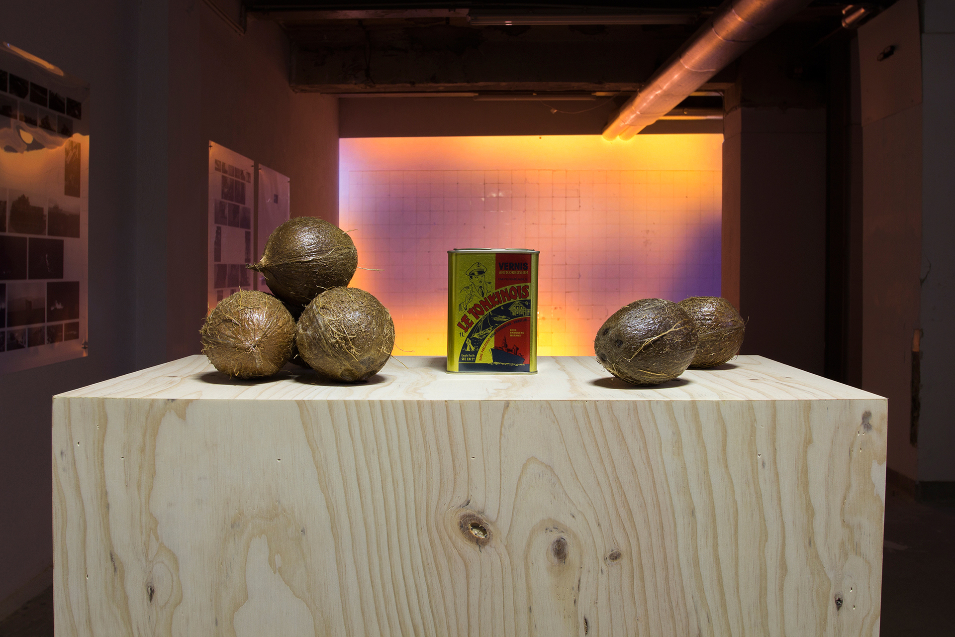 Tin Triebel, Le Tonkinois, 2021, boat varnish on coconuts, paint can and wooden box, 120 x 75 x 35 cm