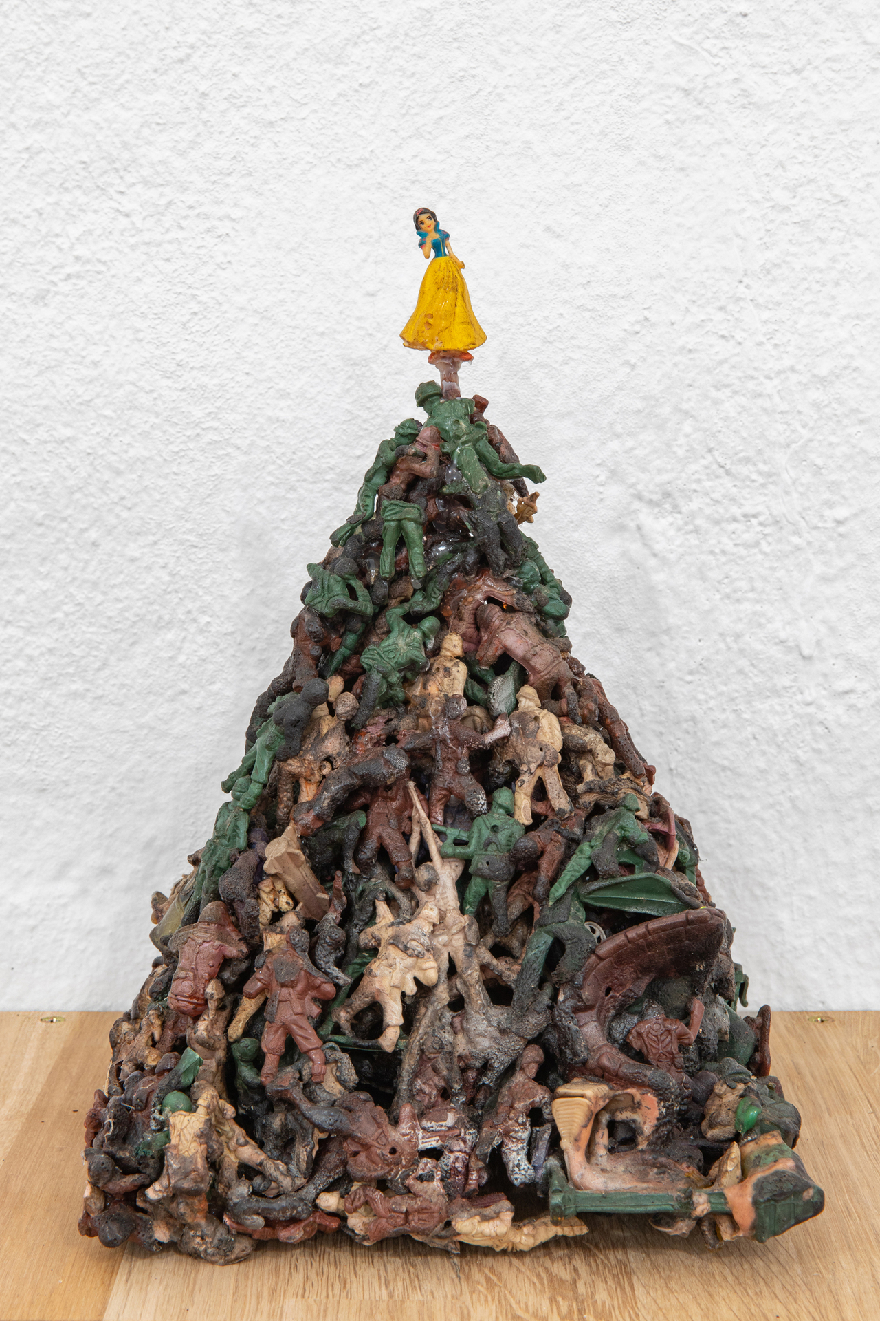 detail: Five Types of Soldiers, 2011, plastic figurines treated with cyanoacrylate and nitrogen enriched gasoline, 17 × 27 × 20 cm on top of handcrafted oak shelf, courtesy of the gallery