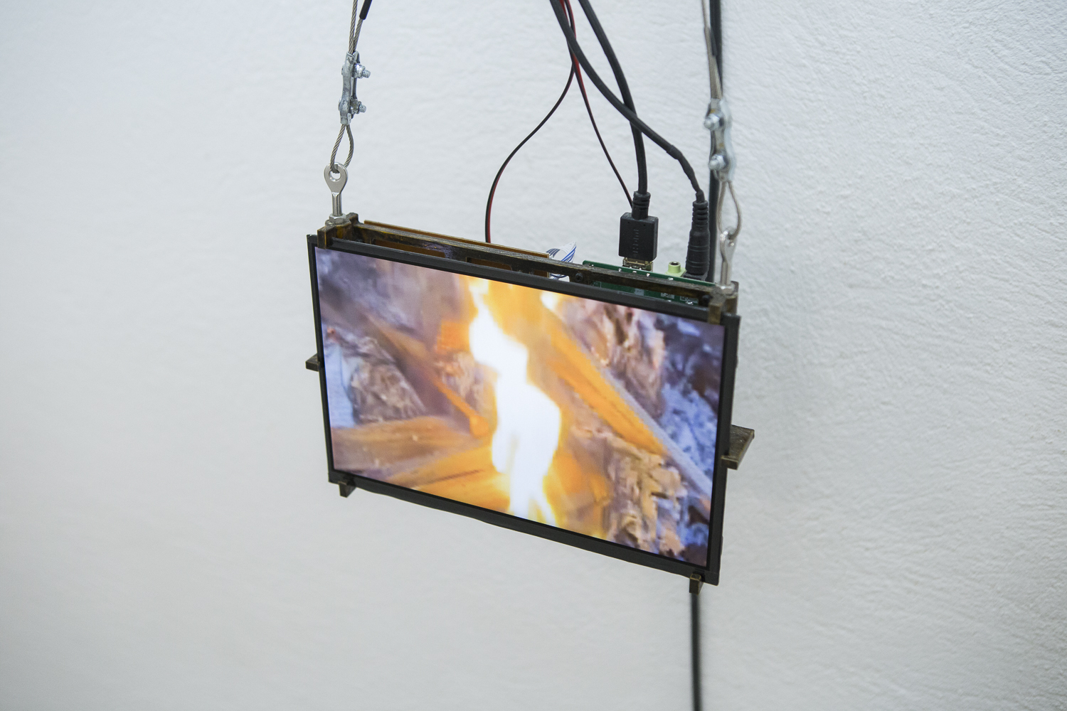 Detail of Thomas P. Grogan, L’Ami du Feu, 2021, Polyester resin, stone grit, oxidised steel, polylactic acid, copper powder, stepper motor, Raspberry Pi, power supply, computer fans, push button, accelerometer, 11 inch screen and interface, 90 x 24 x 19 cm