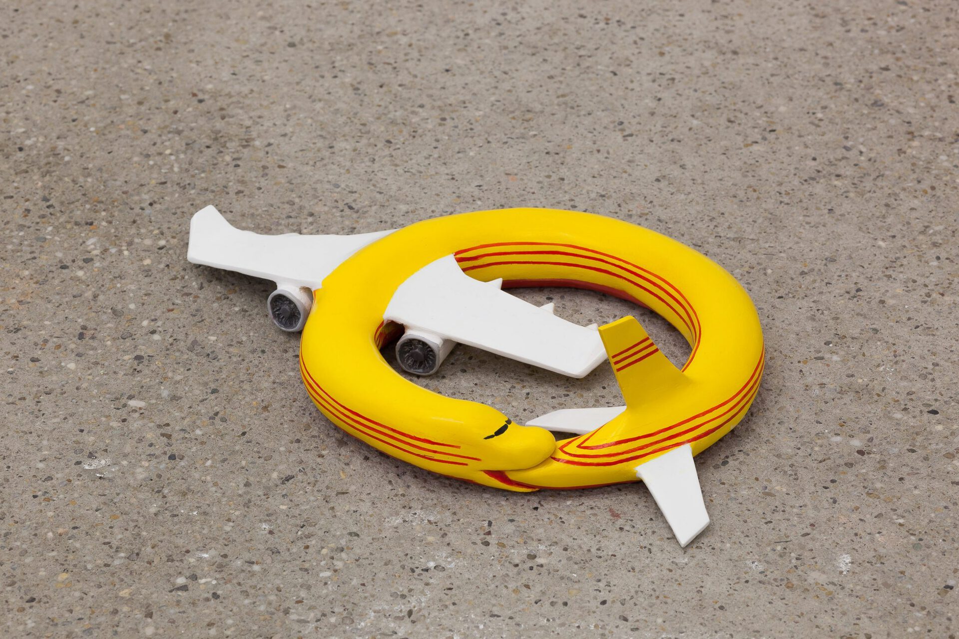 Paul Spendier, "Sleeping Plane (red and yellow striped)", 2021, acrylic resin casting, varnished, Ø 37 cm