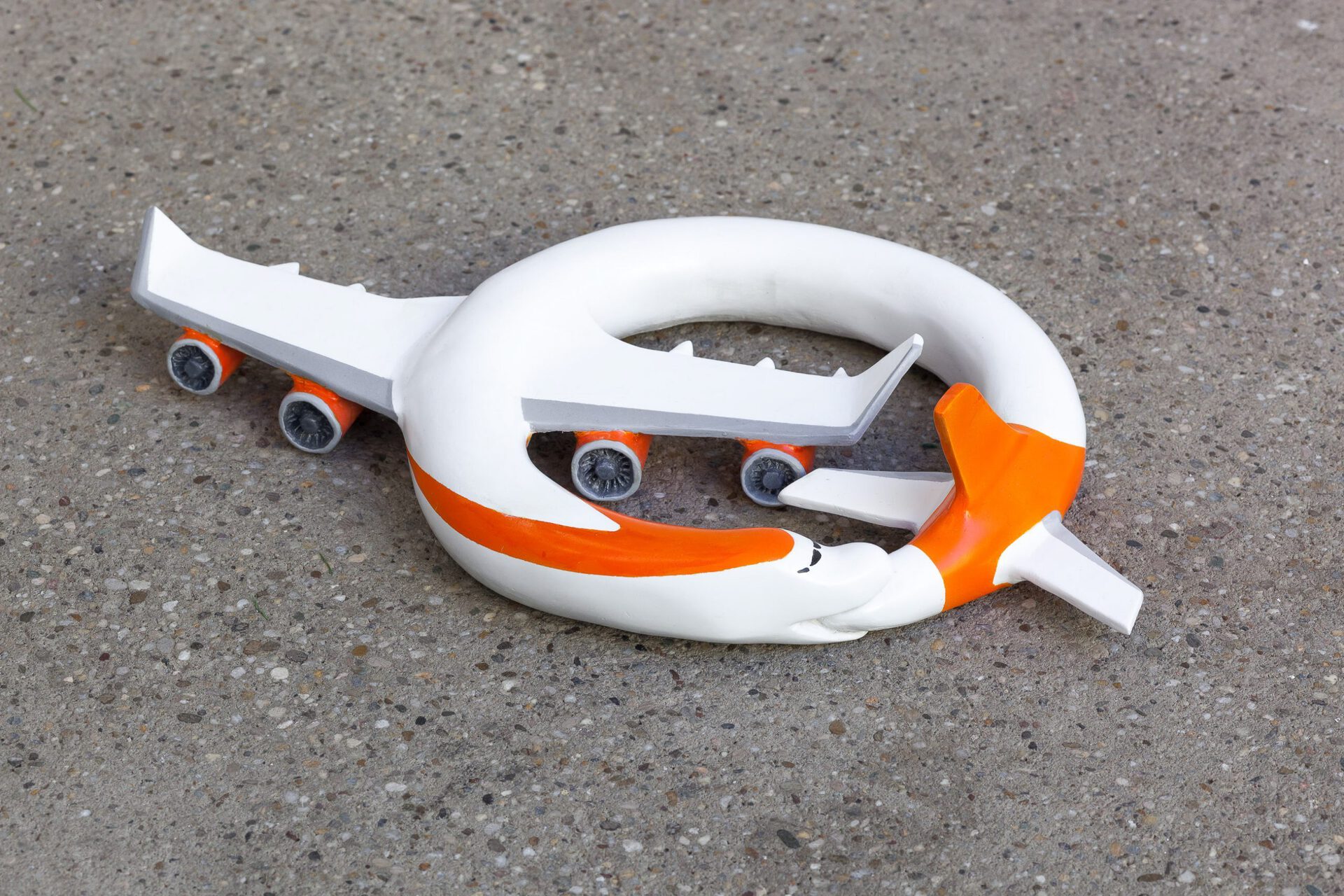 Paul Spendier, "Sleeping Plane (orange marked)", 2021, acrylic resin casting, varnished, Ø 37 cm