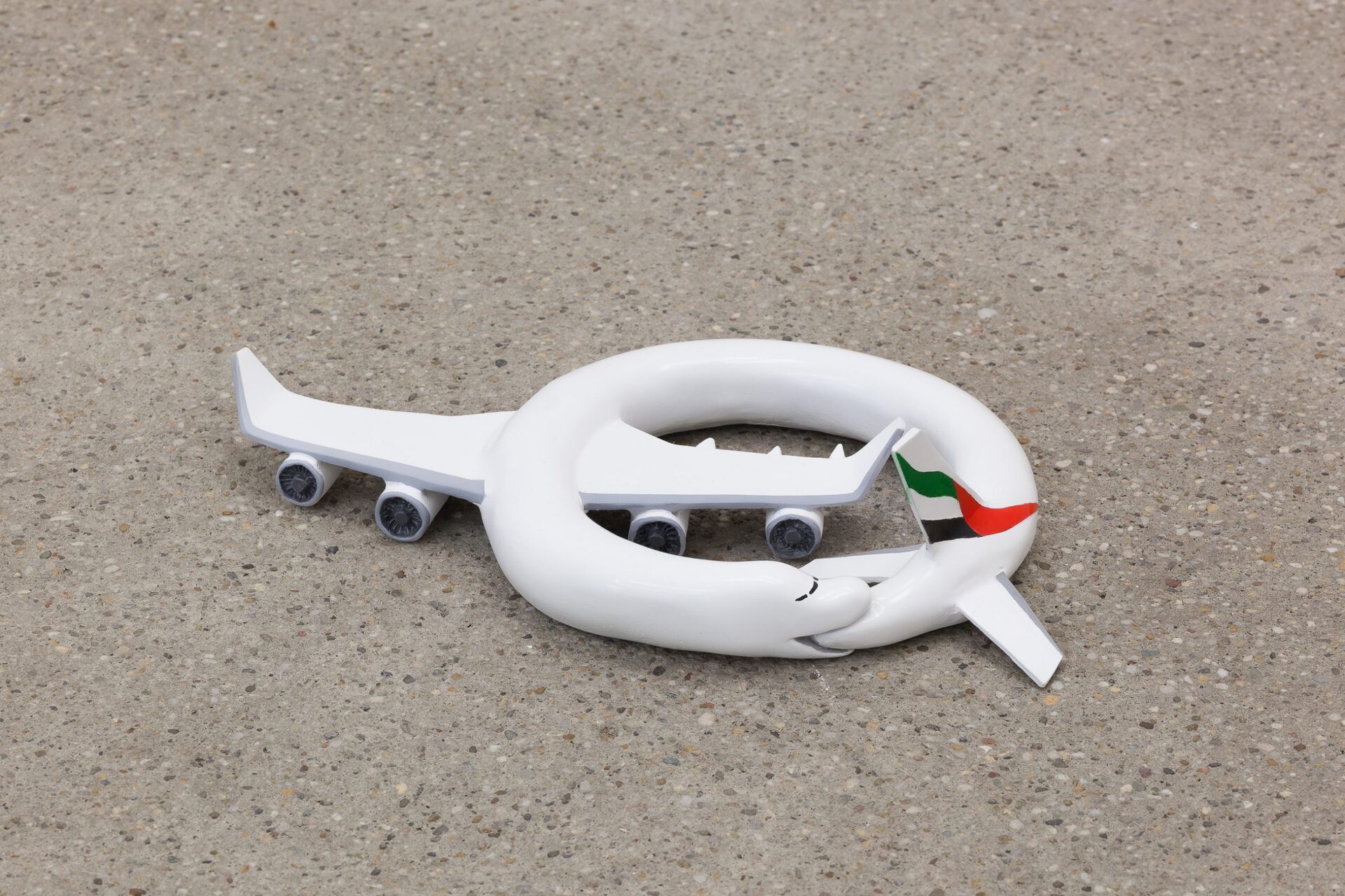Paul Spendier, "Sleeping Plane (black, red and green striped)", 2021, acrylic resin casting, varnished, Ø 37 cm