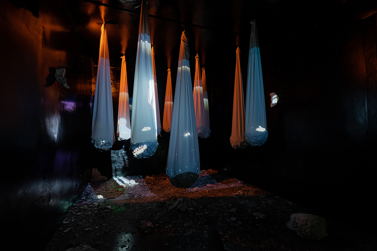 Ana Pascu, Transfixing Shells, 2021  installation, textile and plaster, video projection
