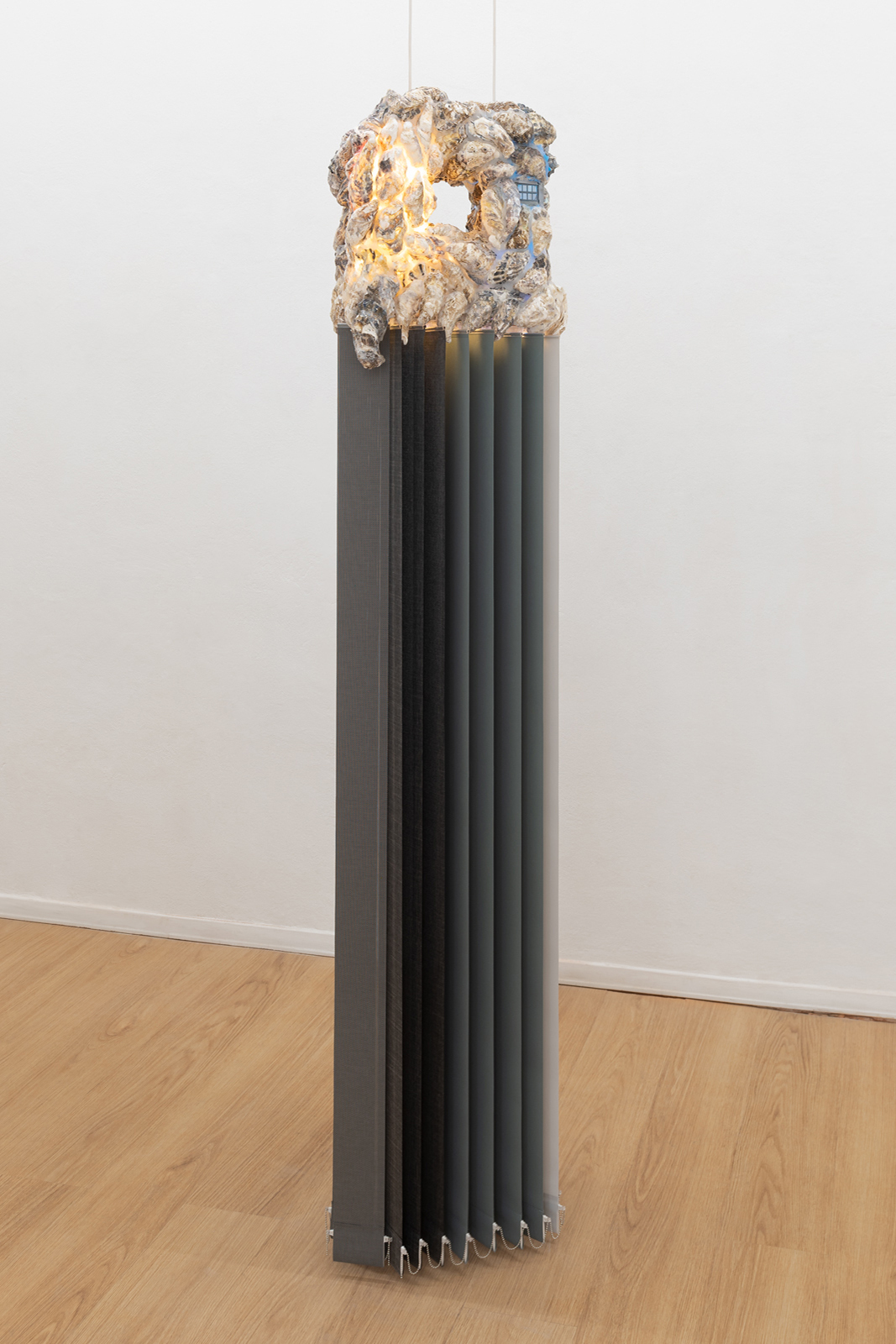 Agata Ingarden  Rooftop Glamour, 2022 Stainless steel, oyster shells, glue, wires, neon bulbs, plastic window model, double sided mirror, blinds , 200x47x29 cm Courtesy: the artist
