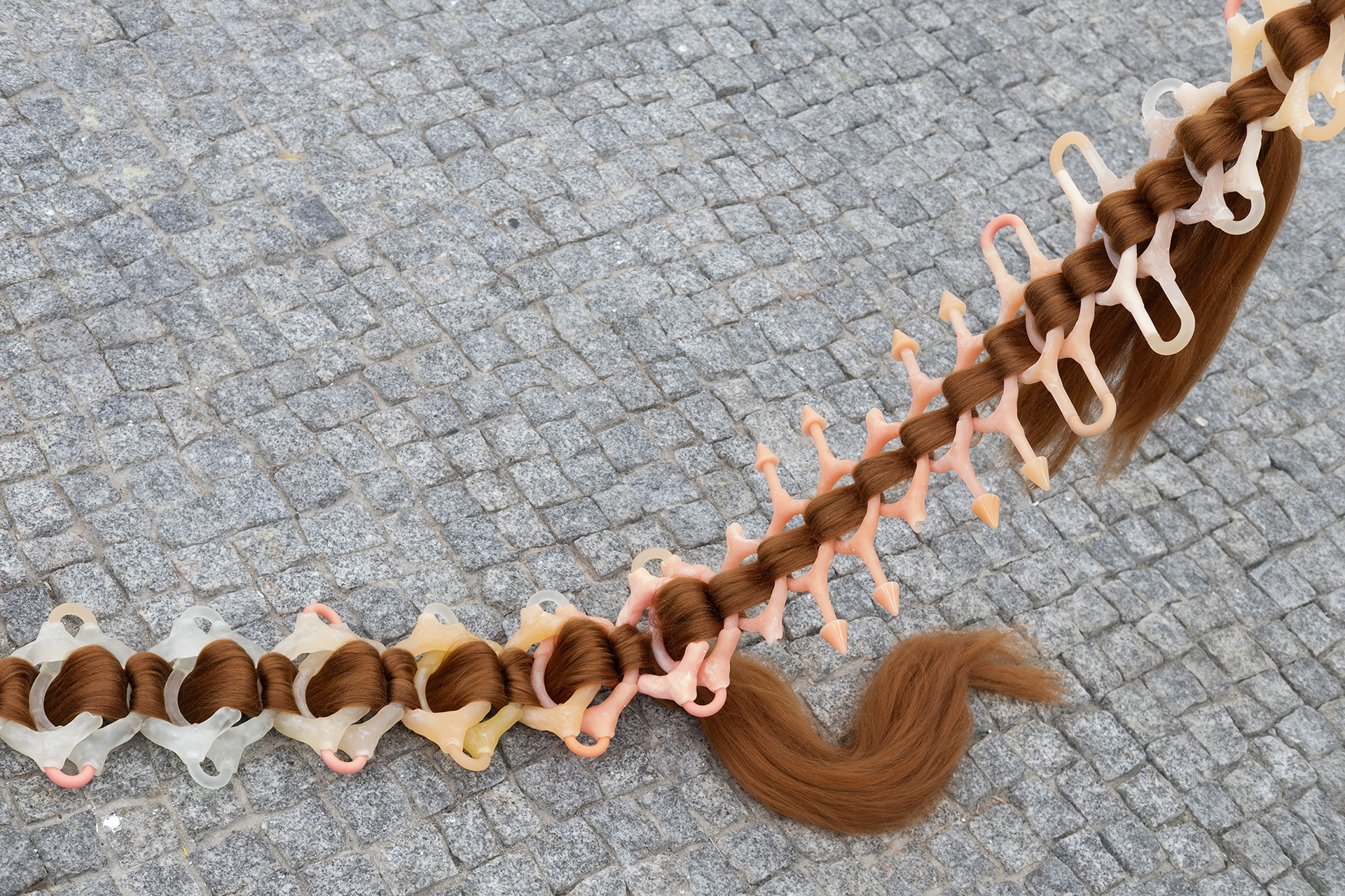 Zu Kalinowska, The Softness of the Cold Shoulder 2022 Synthetic Hair, Epoxy 49x7x400cm