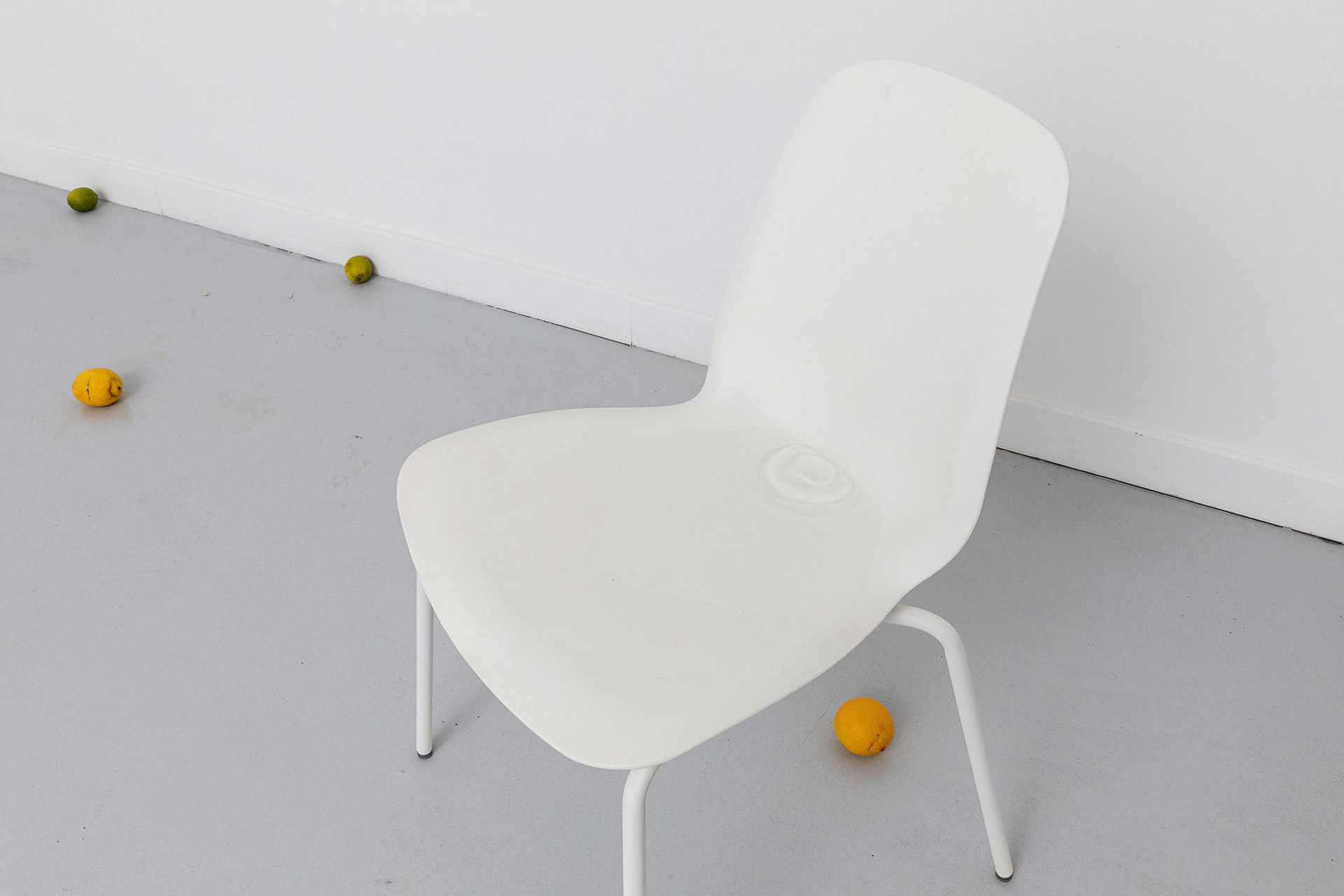 Untitled (Rain), 2019 - 2022, plastic bottle, water, plastic chair, lemons, limes, variable dimensions