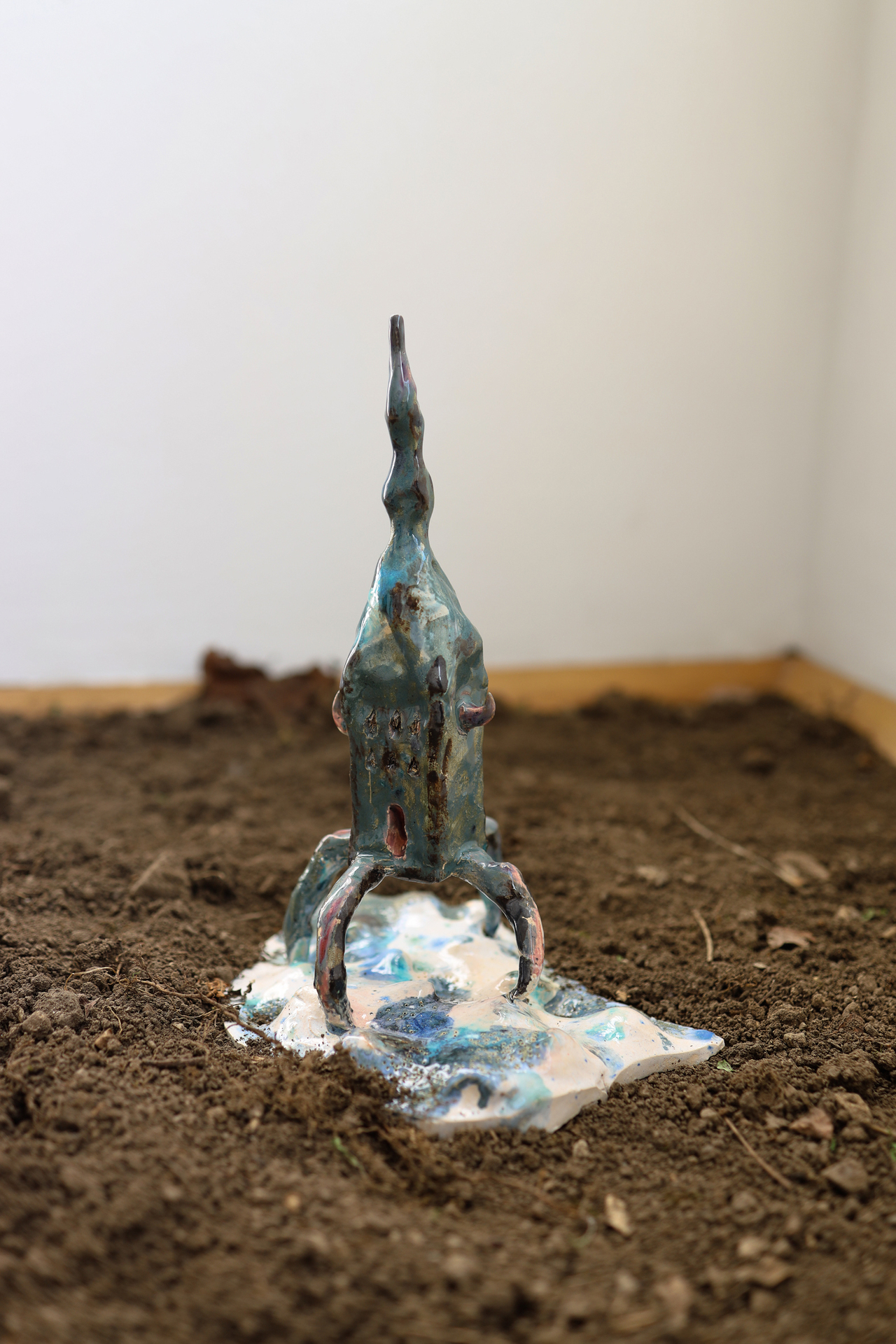 Anna Bochkova, Defending house, 2022, glazed ceramics, soil, 30x19x16 cm