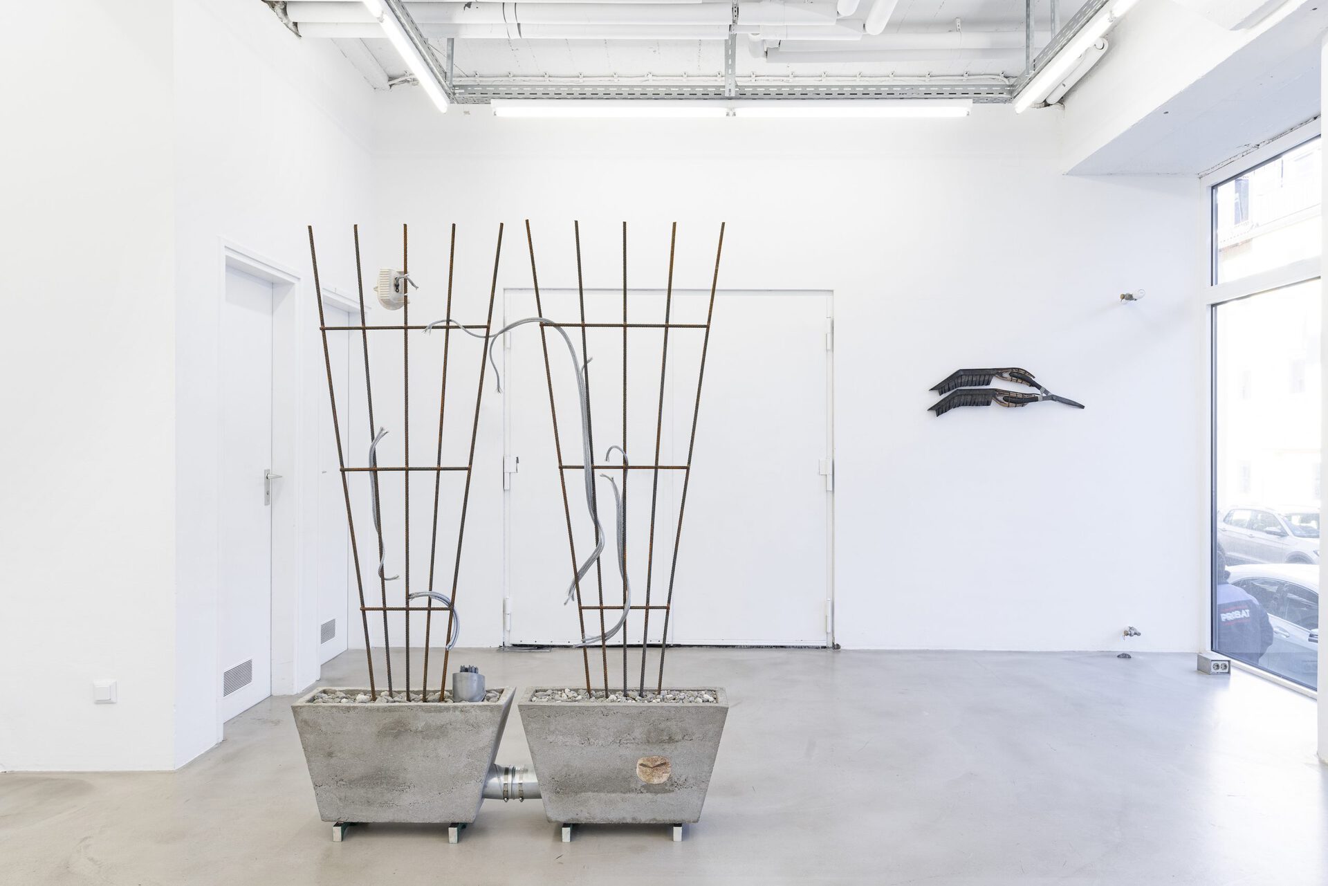 Josephine Baker - Versunkene Landschaft (Sunken Landscape) #3, 2022, cable, cable ties, concrete, concrete rubble, coral fragments, Dover chalk, epoxy resin, fossil fishes (Knight Alta, Eocene rock), paint, pine, plaster, plywood, rubber, security light, steel ducting, steel reinforcement bars, tube clips, 133x191.5x29 cm