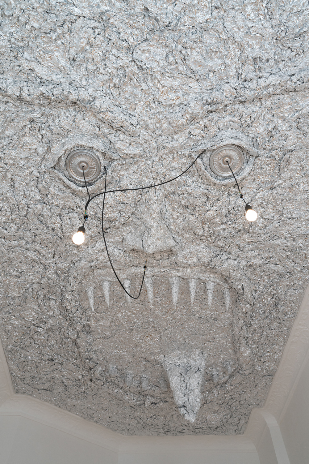 Tobi Keck, Lurer, 2022, Aluminium foil, stucco rosettes, light bulbs, building’s electricity infrastructure, 3.2m x 5.2m x 0.8m, View 5