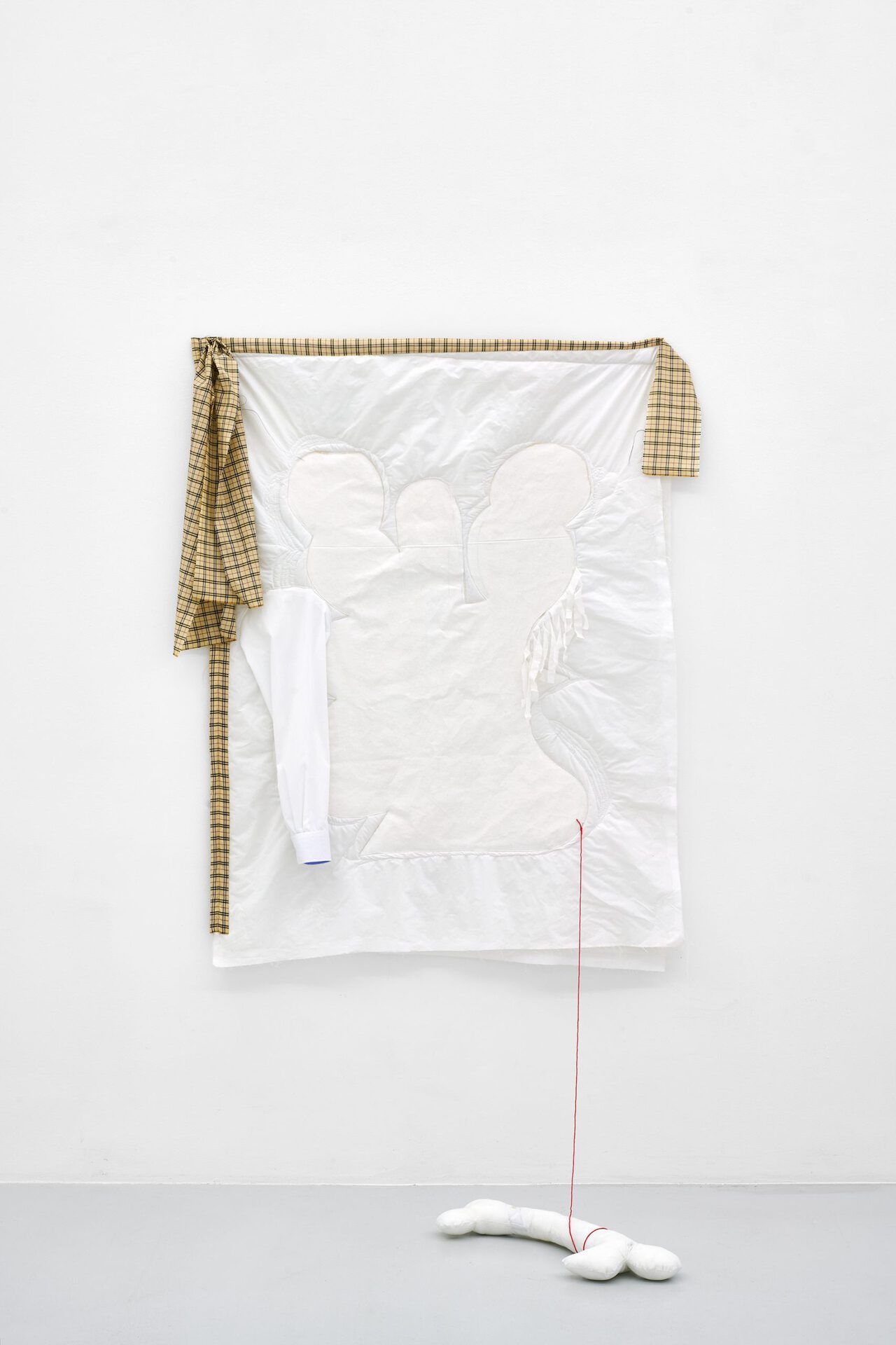 Franca Scholz, Maria with a bone, 2022, cotton textile, canvas, shirt sleeve, embroidery, polyester, overshirt, acrylic, quilted, 148 x 107 cm.