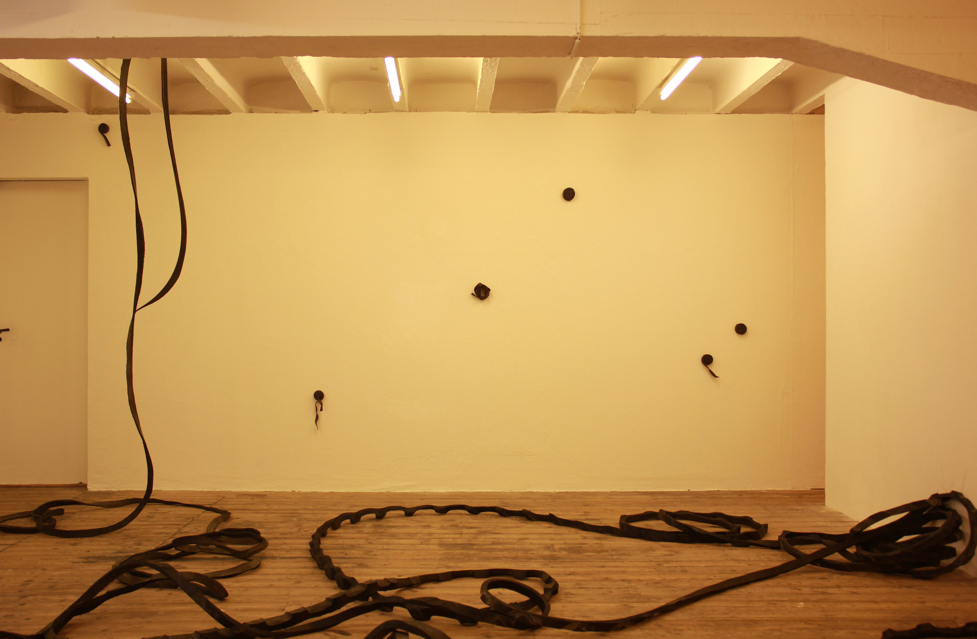 Vanessa Billy Whiplash, 2021 Cut tire, 6000 x 3 x 3 cm; Julia Znoj Deadly Swirls (wrapped up scripts), 2020 Steel strips, galvanised steel strips