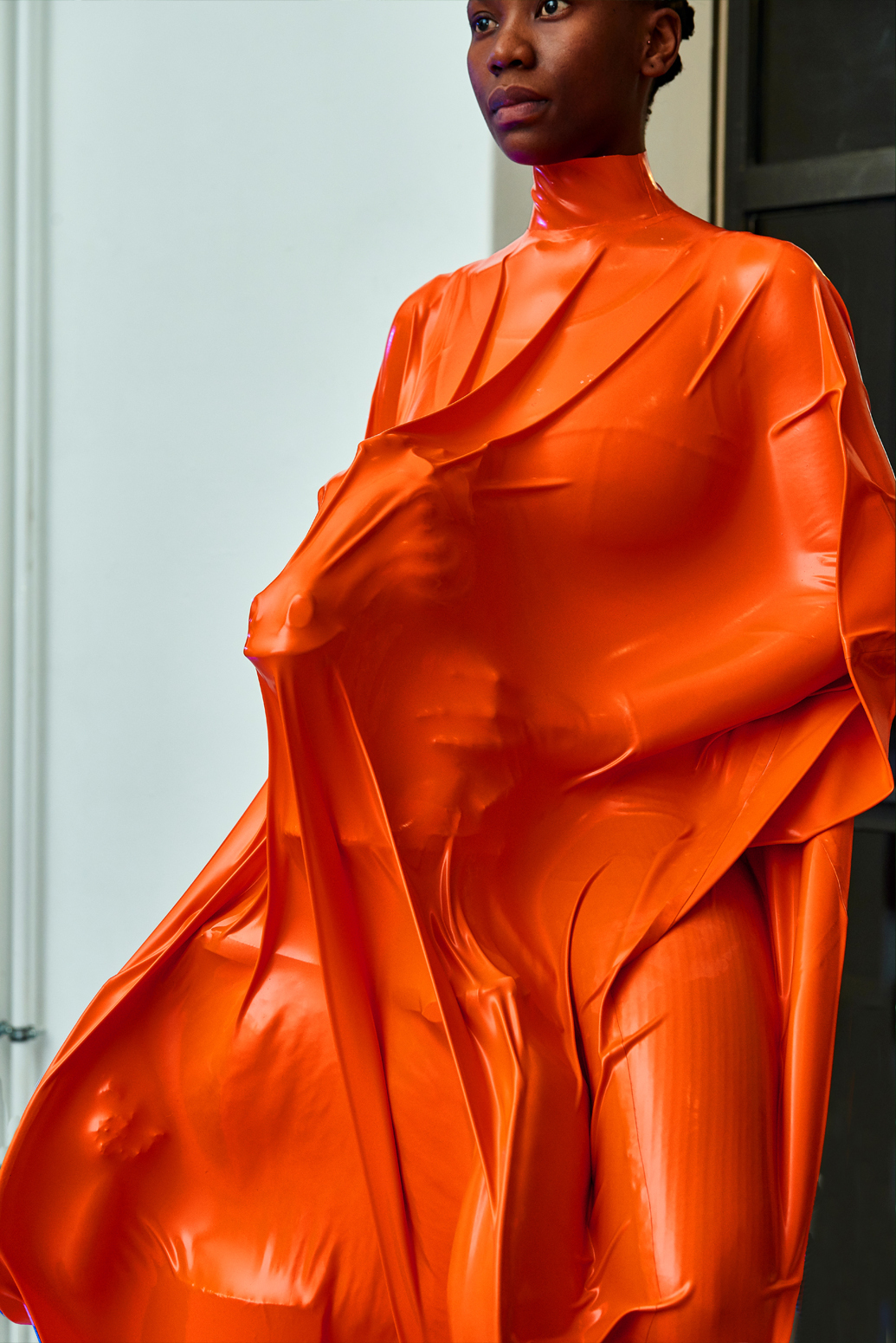 Sarah Ama, Orange: to build to bury to remember, 2022, sculpture-performance