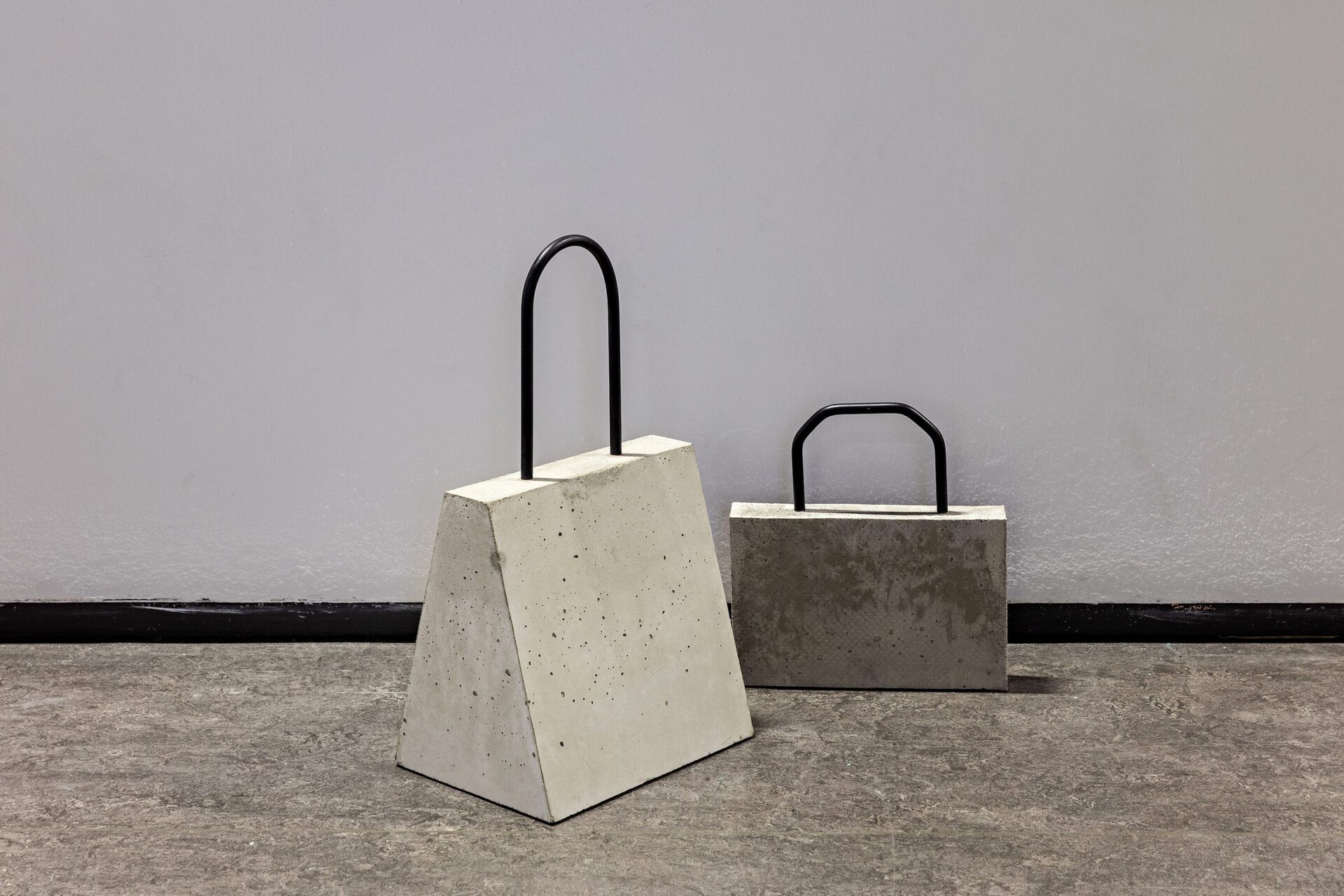 Linda Nadji, PythonHandBag, 2022, Concrete, steel, 33x30x5 cm & WEEKENDER, 2019, Concrete, steel, 56x30x25 cm