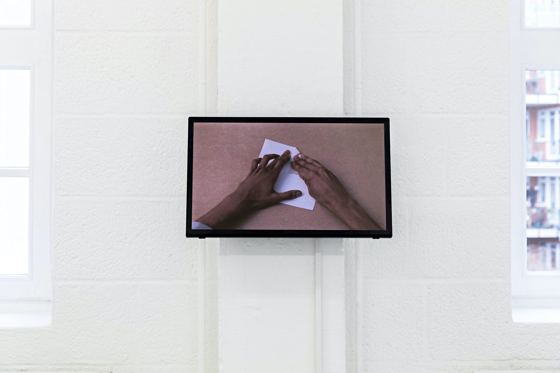 Jimmy Robert, “Untitled (Folding 2)”, 2012 HD Video, Sound, 3:44 min, installation view, Künstlerhaus Bremen 2022