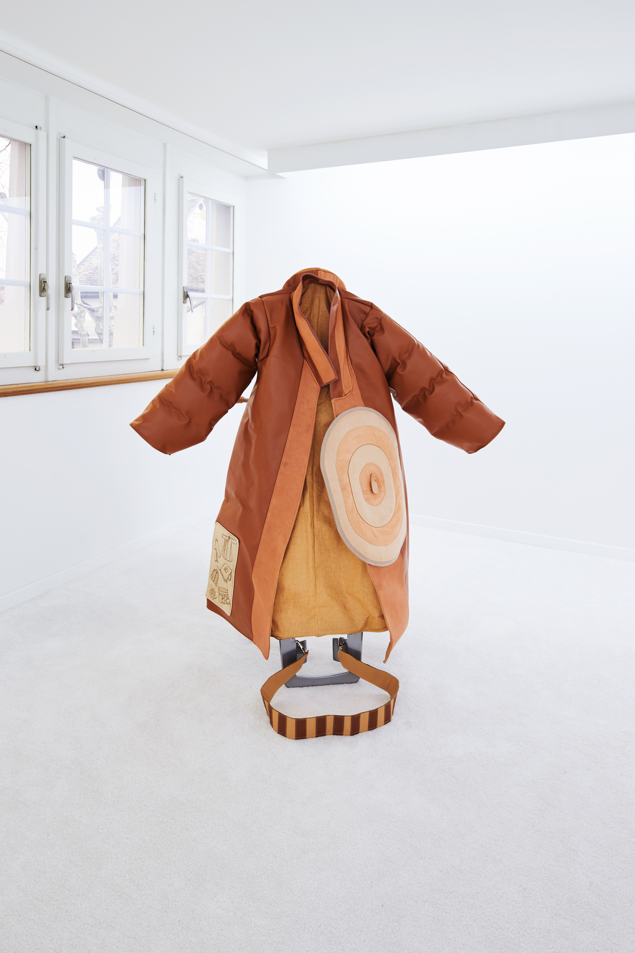 Hansol Kim, TrenchPufferOvercoatBoard , 2020, Leather, Iron board, wax-coated thread, toy stuffing, piping cord, bias tape, zipper, bag hardware, cork fabric, massage cushion 50 x 151.5 x 96 cm