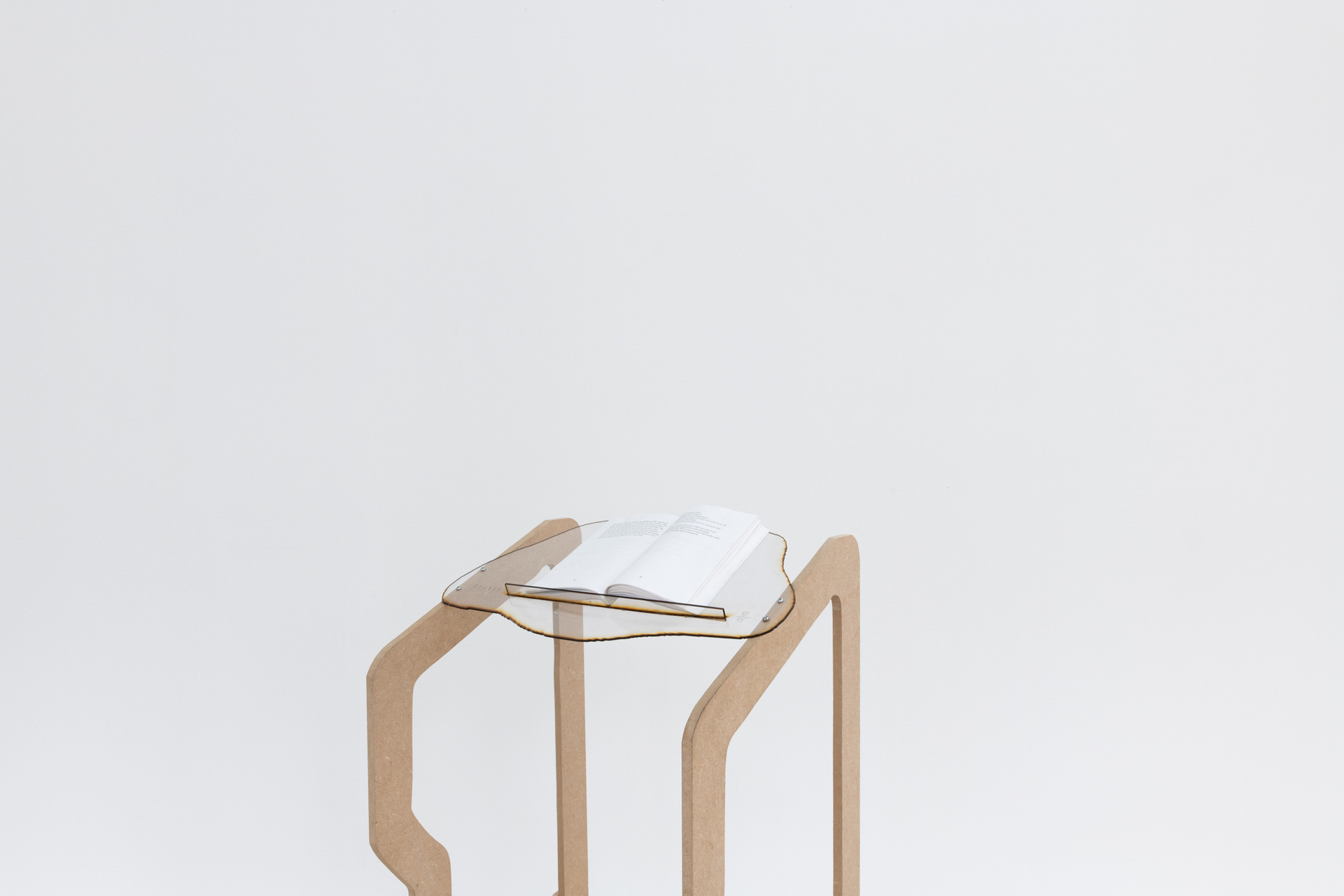 Chae Biole Park, The walker (no.4), 2022, wood, acrylic, wheels, 135x60x50cm. On the walker: Frida & Gyueme - book, 2020