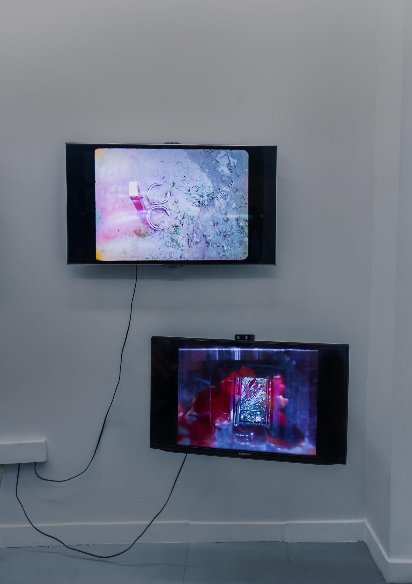 Matthew Burdis & Jon Baker, The Idealist and The Contrarian, 2022, video, various dimension screens