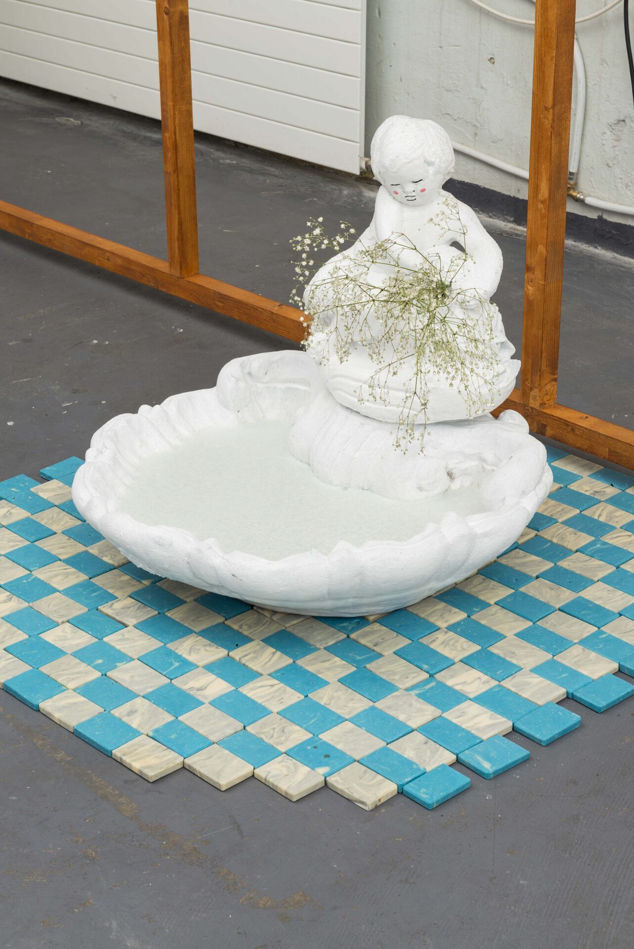 Annabelle Galland & Victor Delétraz, Frozen baby, 2022, Found concrete fountain, synthetic lacquer, soap, window paint, soap tiles, dimensions variable