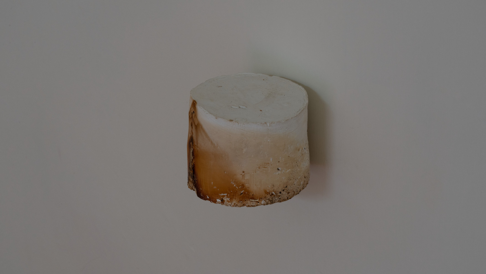 Kong Chun Hei, Dried paint on wall, 2022, Dried enamel paint, stainless steel holder, 9 x 7 cm