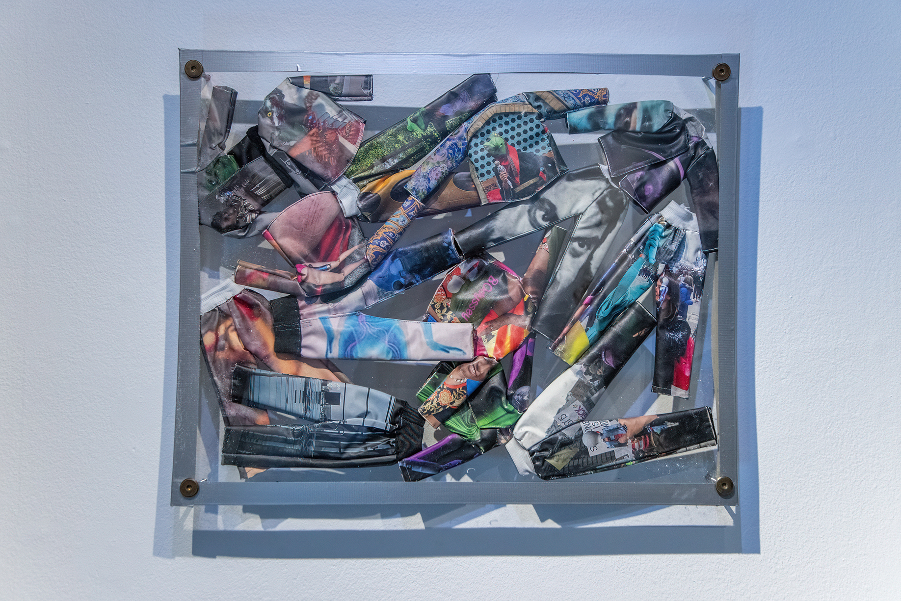 Suits, 2018, tailored prints on fabrics, plexiglass, metal bolts, tape, 49  x 61 x 2 cm