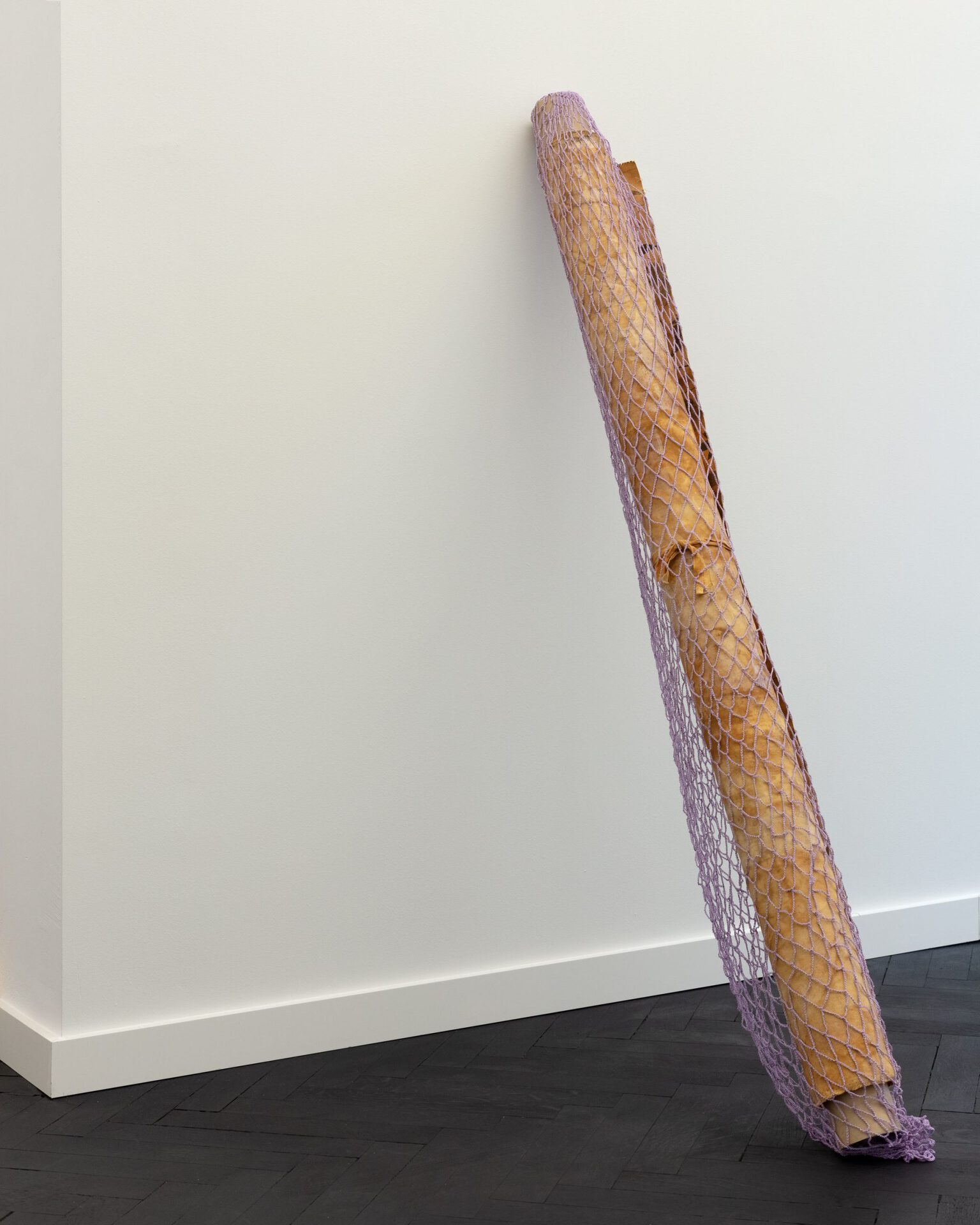 Anna Orłowska, Tablecloth, 2022, Print on cotton, bone glue, iron ore residue, cotton crochet, cardboard, 170 cm x 20 cm x 20 cm