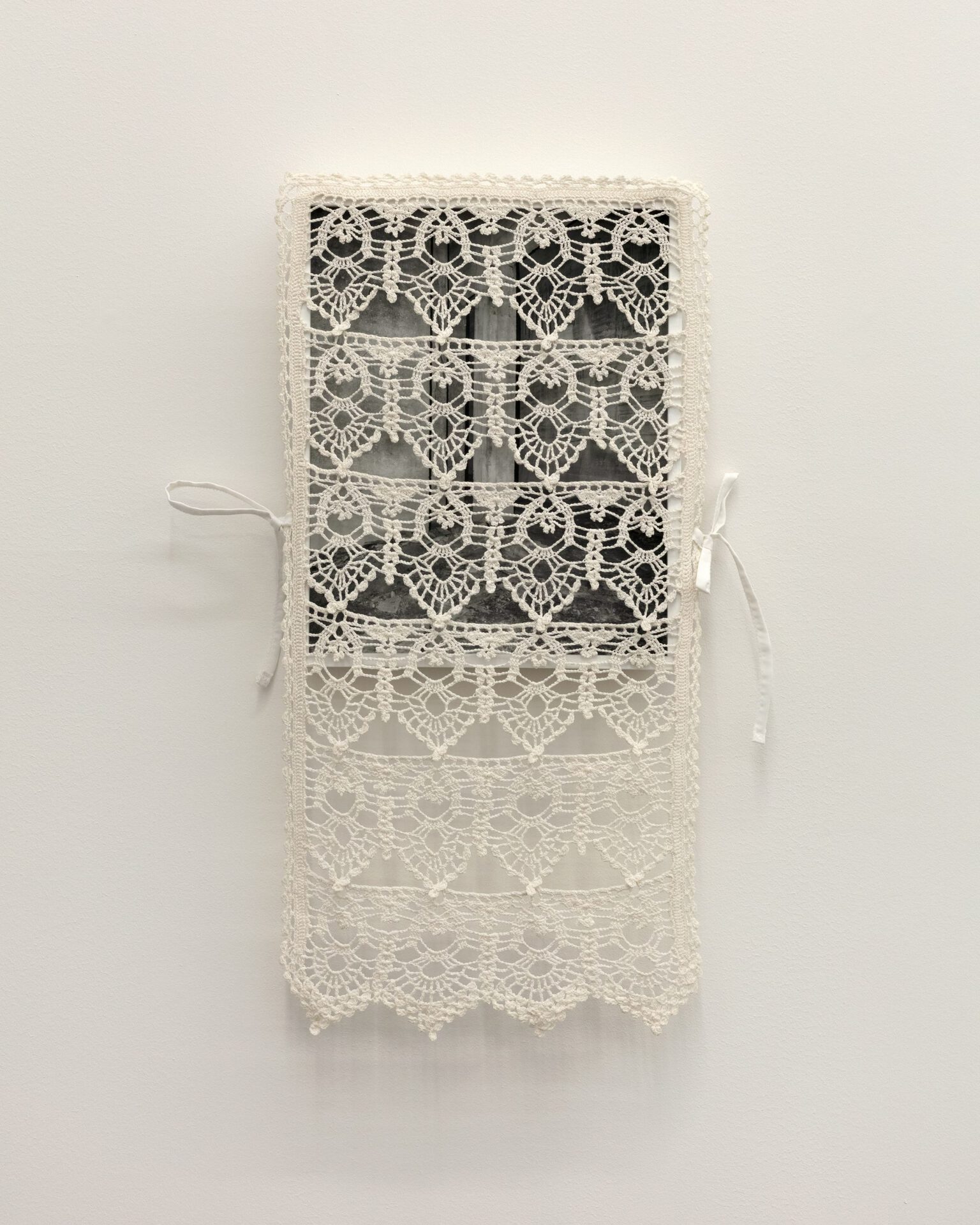 Anna Orłowska, Foundation, 2022, Gelatine silver print, mounted on cardboard, ivory wooden frame, museum glass, cotton crochet, polyester, unique, 37 x 30 cm