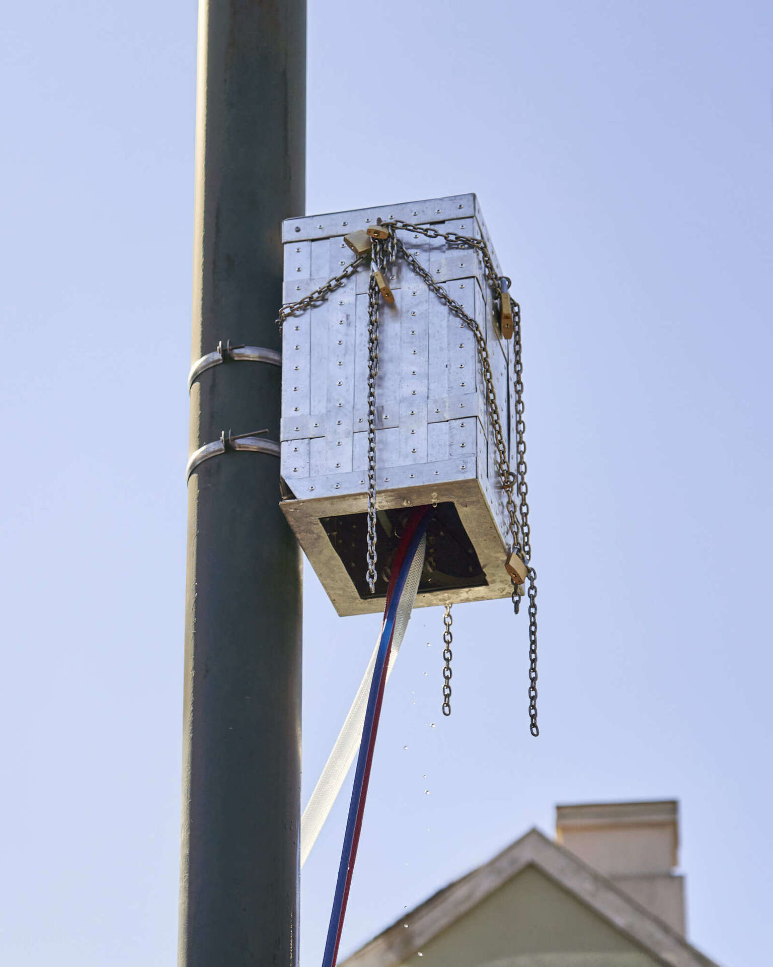Mia Edelgart & Sebastian Hedevang, Dance Macabre, 2022, Aluminum, stainless steel, rivets, enamel paint, glass eyes, wires, bells, locks, chains, rubber hoses, water pump.