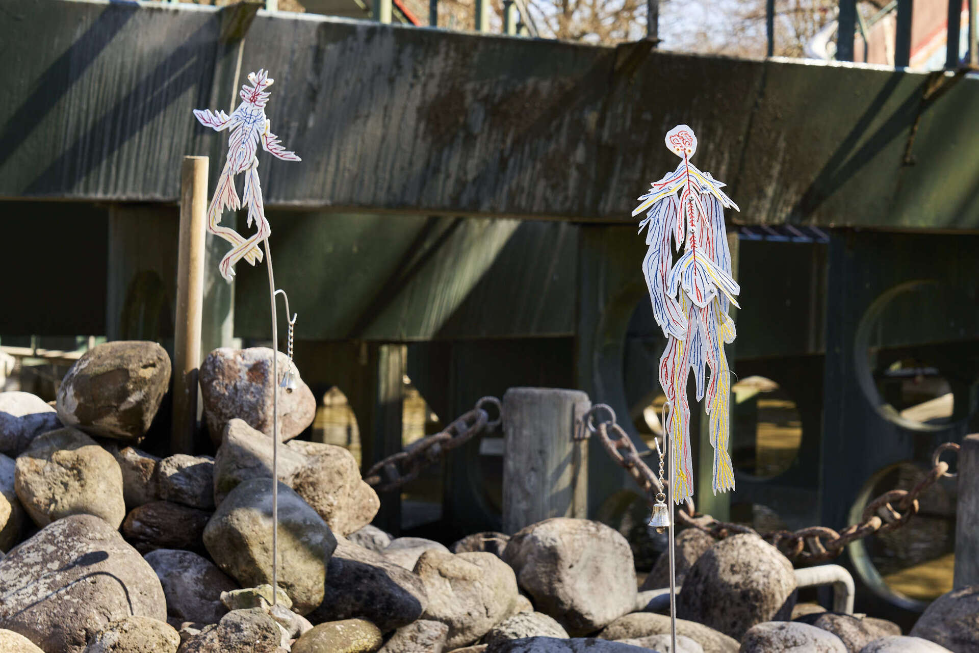 Mia Edelgart & Sebastian Hedevang, Dance Macabre, 2022, Aluminum, stainless steel, rivets, enamel paint, glass eyes, wires, bells, locks, chains, rubber hoses, water pump.